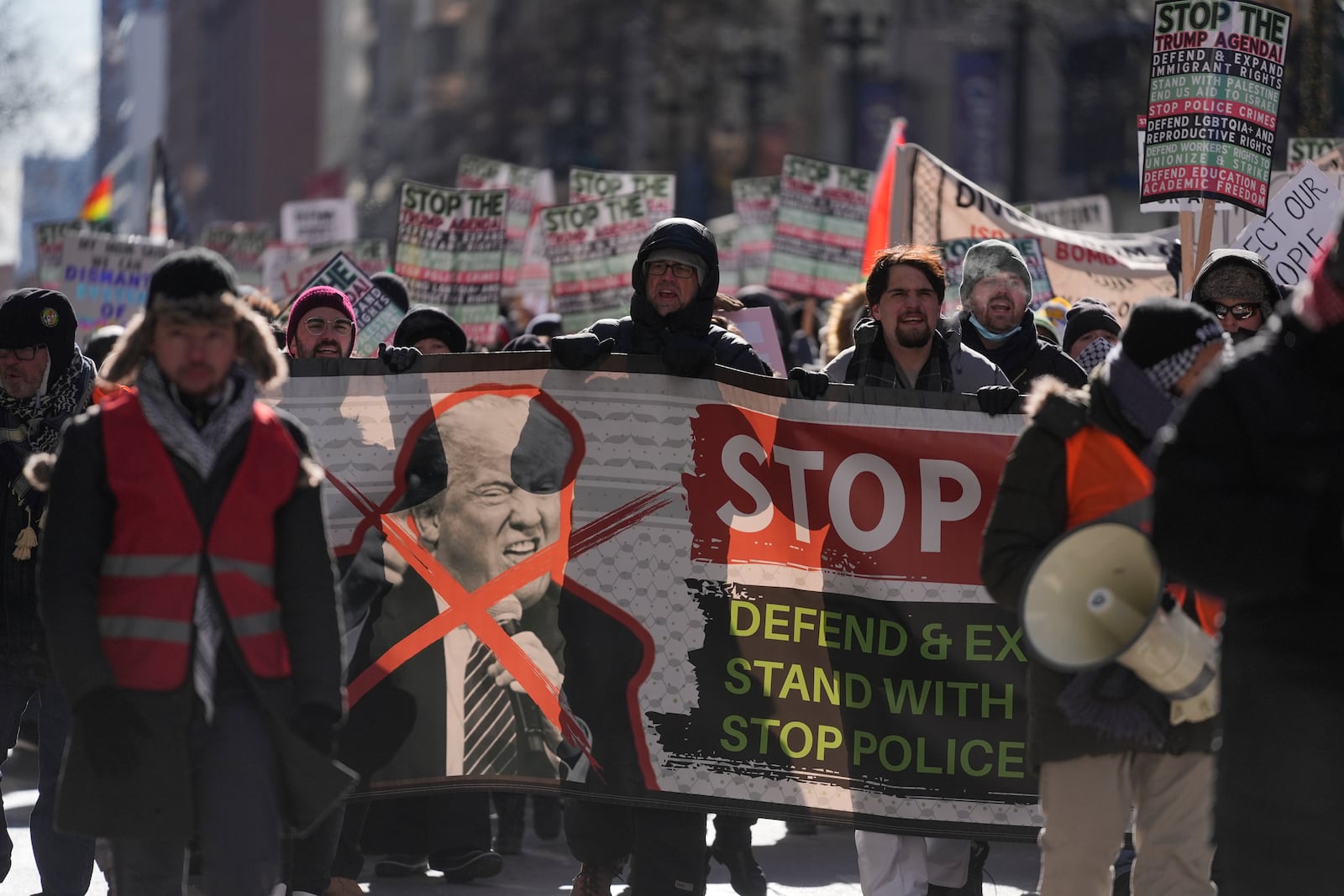 Anti-Trump protesters march to Trump Tower as they rally for a number of issues, including immigrant rights, the Israel-Hamas war, women's reproductive rights, racial equality and others, on the day of President Trump's Inauguration, Monday, Jan. 20, 2025, in Chicago. (AP Photo/Erin Hooley)