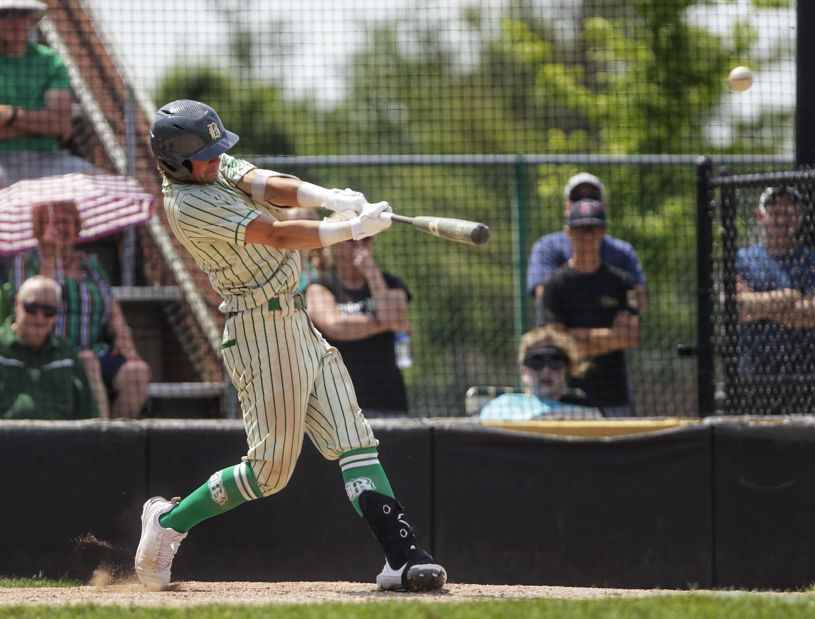 Badin's Brady Imhoff hits a double during their 5-0 win over Wyoming Saturday, June 5, 2021 in Mason. NICK GRAHAM / STAFF