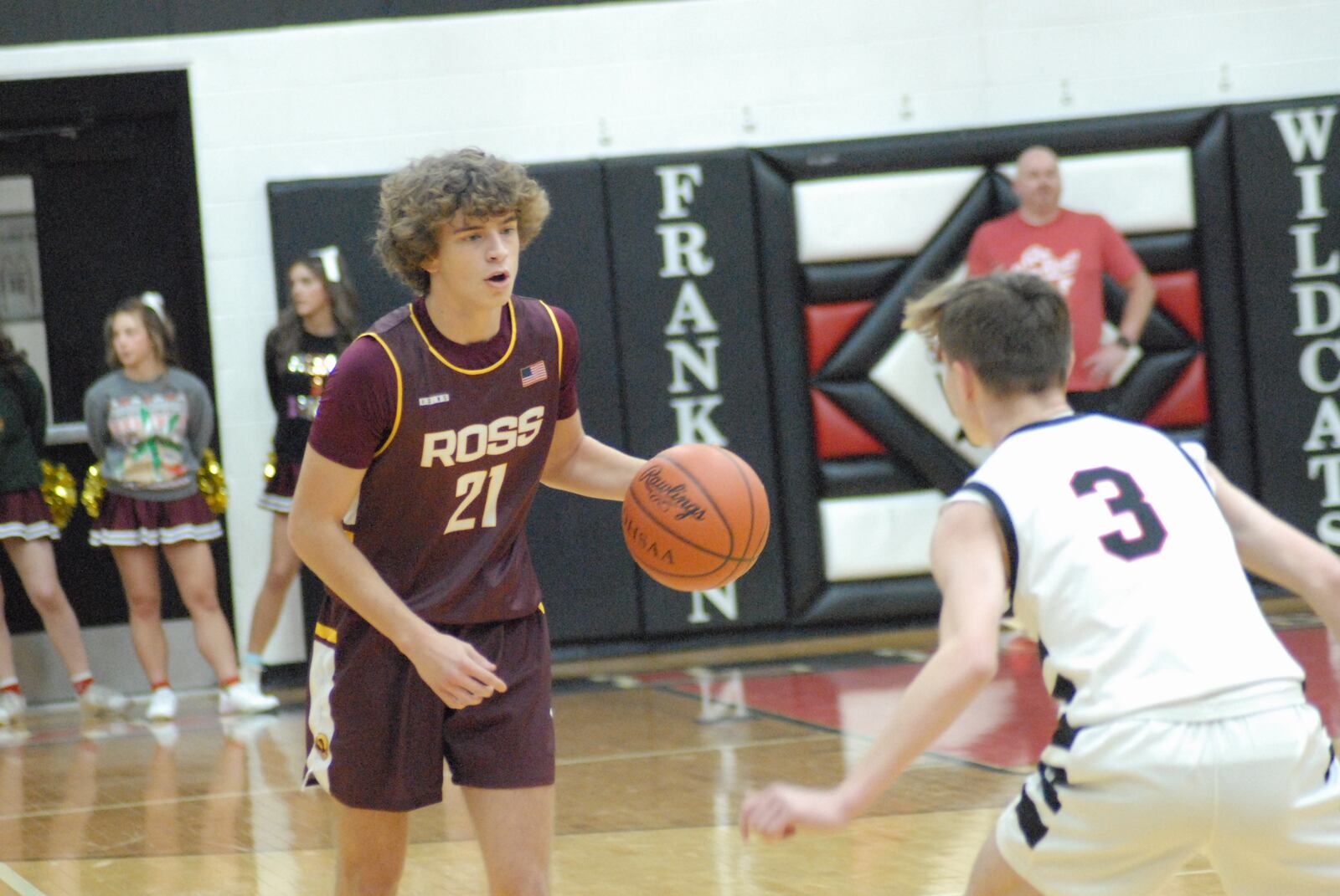 Ross junior Will Schaefer is guarded by Franklin senior Jace Murphy during Friday night's game at Franklin. Chris Vogt/CONTRIBUTED