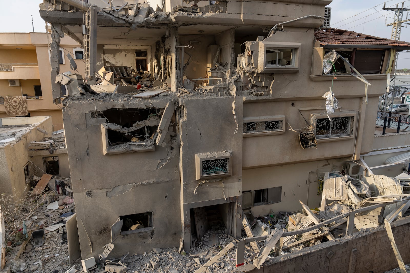 A view of a damaged home after projectiles fired from Lebanon in Tira, central Israel, Saturday, Nov. 2, 2024. (AP Photo/Ariel Schalit)