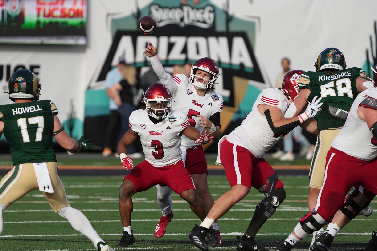 Miami (Ohio) quarterback Brett Gabbert (5) throws downfield against Colorado State in the first half of the Arizona Bowl NCAA college football game, Saturday, Dec. 28, 2024, in Tucson, Ariz. (AP Photo/Rick Scuteri)