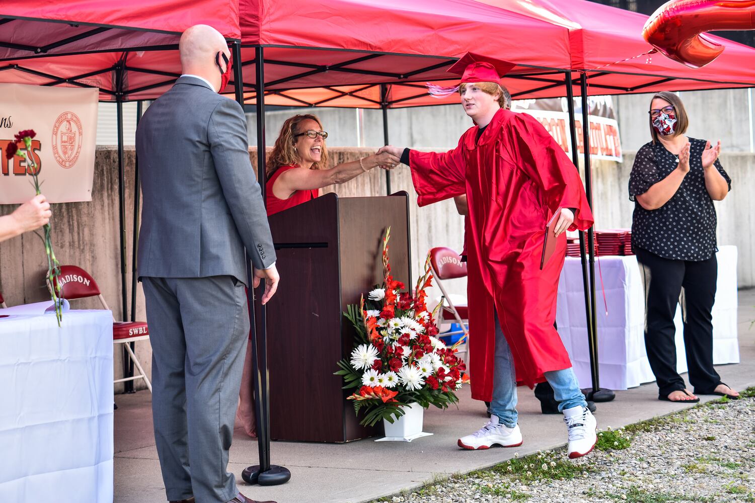 Madison High School drive-thru graduation ceremony at Land of Illusion