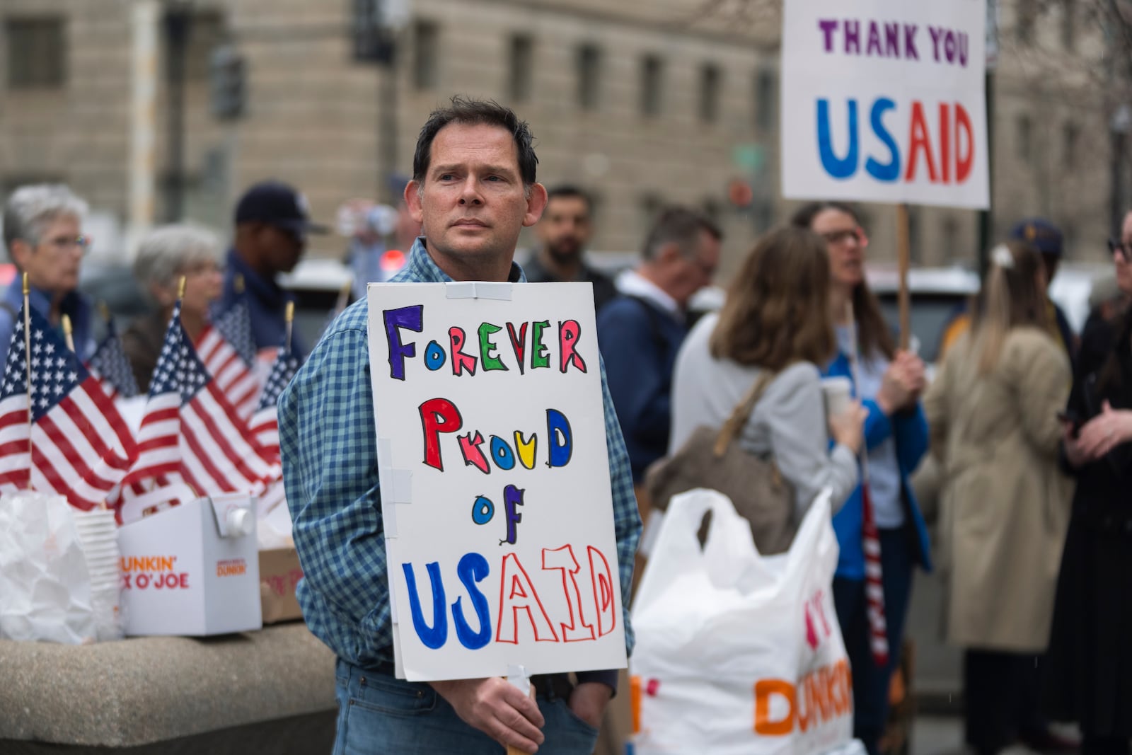 Former United States Agency for International Development (USAID) workers show their support to USAID workers retrieving their personal belongings from USAID's headquarters in Washington, Thursday, Feb. 27, 2025. (AP Photo/Manuel Balce Ceneta)