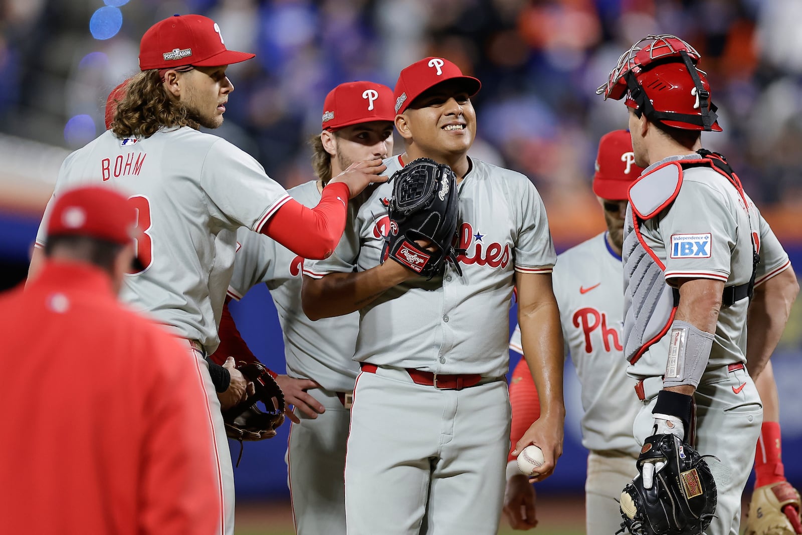 Philadelphia Phillies pitcher Ranger Suárez, center, reacts as he waits to be relieved during the fifth inning of Game 4 of the National League baseball playoff series against the New York Mets, Wednesday, Oct. 9, 2024, in New York. (AP Photo/Adam Hunger)