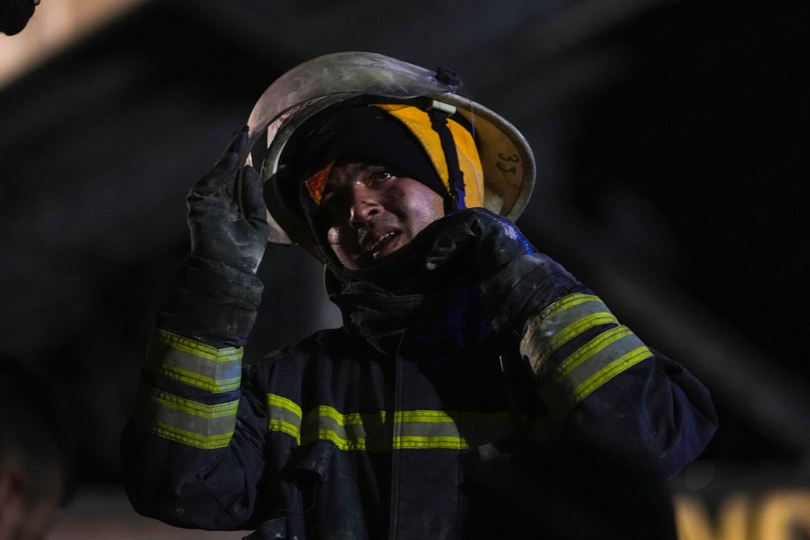 Firefighters and emergency teams work after a fire that broke out at a hotel in the ski resort of Kartalkaya, located in Bolu province, northwest Turkey, on Tuesday, Jan. 21, 2025. (AP Photo/Francisco Seco)