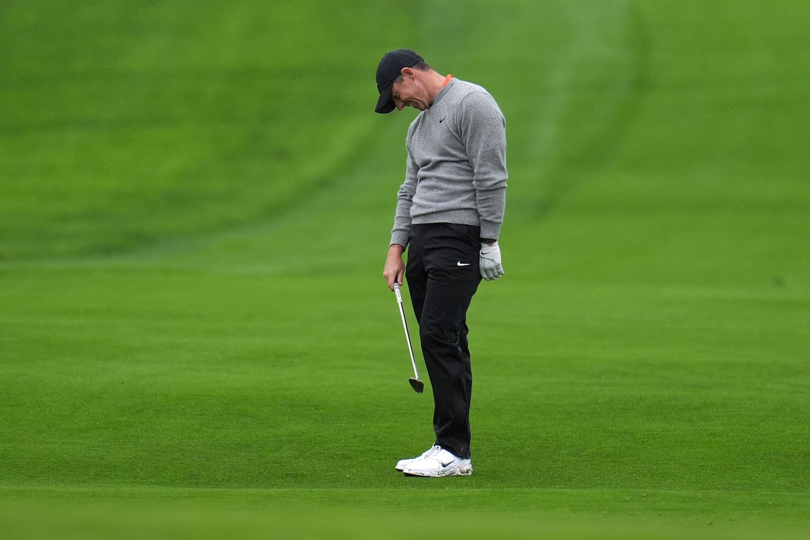 Rory McIlroy, of Northern Ireland, reacts to his fairway shot on the sixth hole of the South Course at Torrey Pines during the first round of the Genesis Invitational golf tournament Thursday, Feb. 13, 2025, in San Diego. (AP Photo/Gregory Bull)