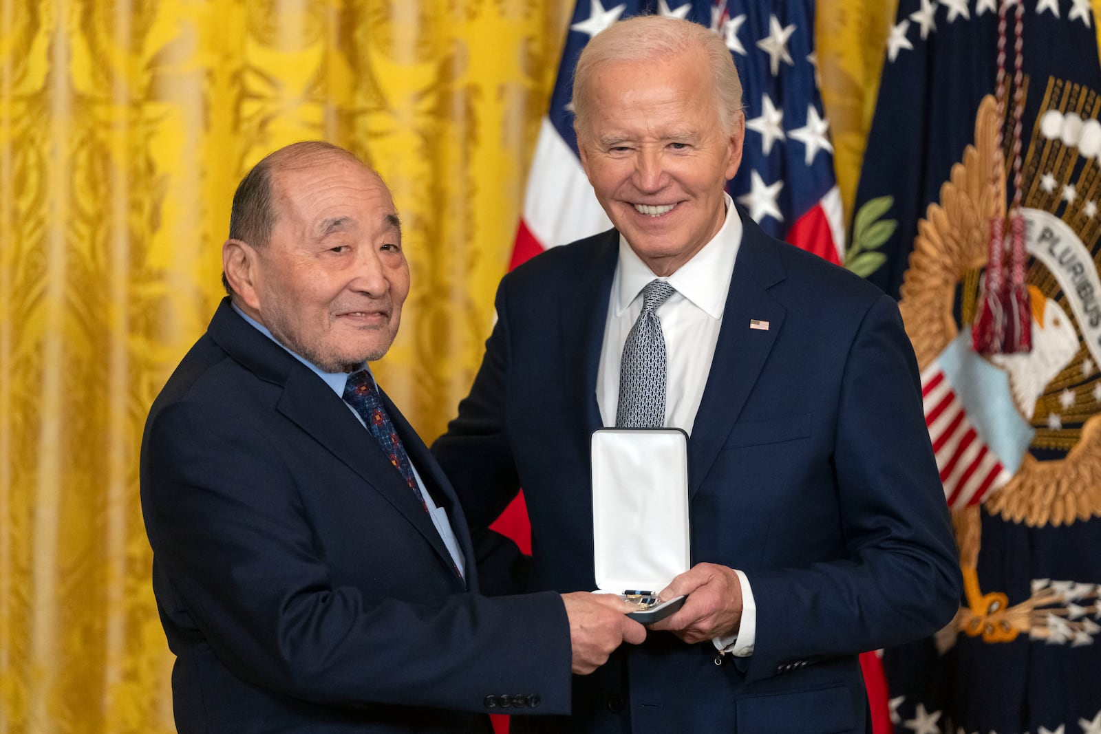 President Joe Biden awards the Presidential Citizens Medal to Wayne Tsutsumi on behalf of Mitsuye Endo Tsutsumi during a ceremony in the East Room at the White House, Thursday, Jan. 2, 2025, in Washington. (AP Photo/Mark Schiefelbein)