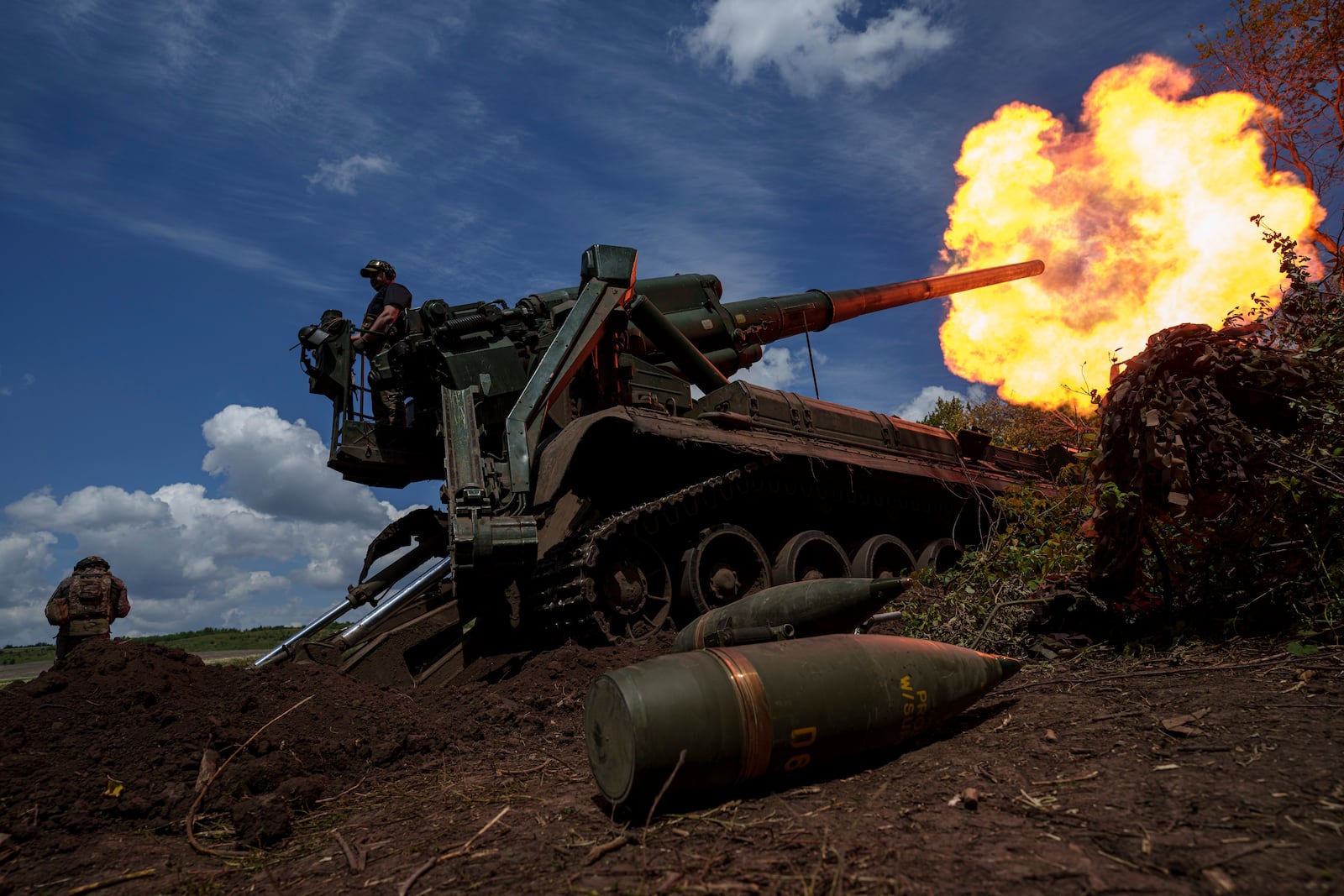 FILE - Ukrainian soldiers of 43rd artillery brigade fire by 2s7 self-propelled howitzer towards Russian positions at the frontline in Donetsk region, Ukraine, Monday, June 24, 2024. (AP Photo/Evgeniy Maloletka, File)