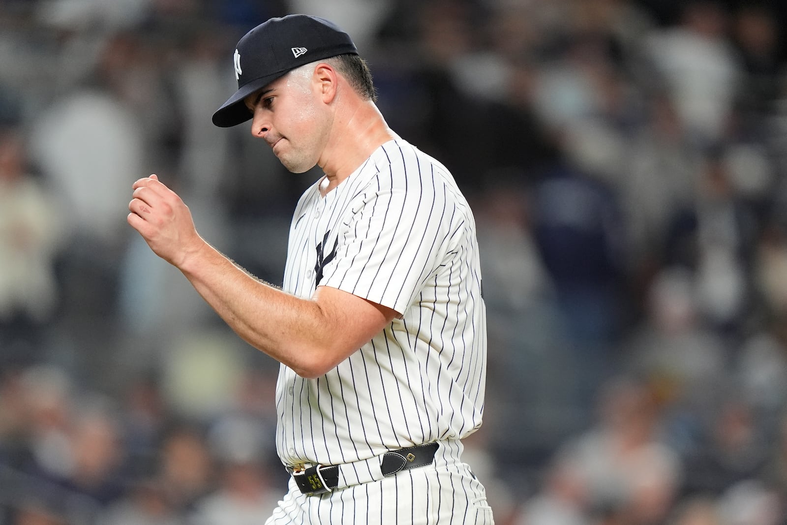 New York Yankees pitcher Carlos Rodón reacts as he walks off the field during the fourth inning of Game 2 of the American League baseball playoff series against the Kansas City Royals, Monday, Oct. 7, 2024, in New York. (AP Photo/Frank Franklin II)