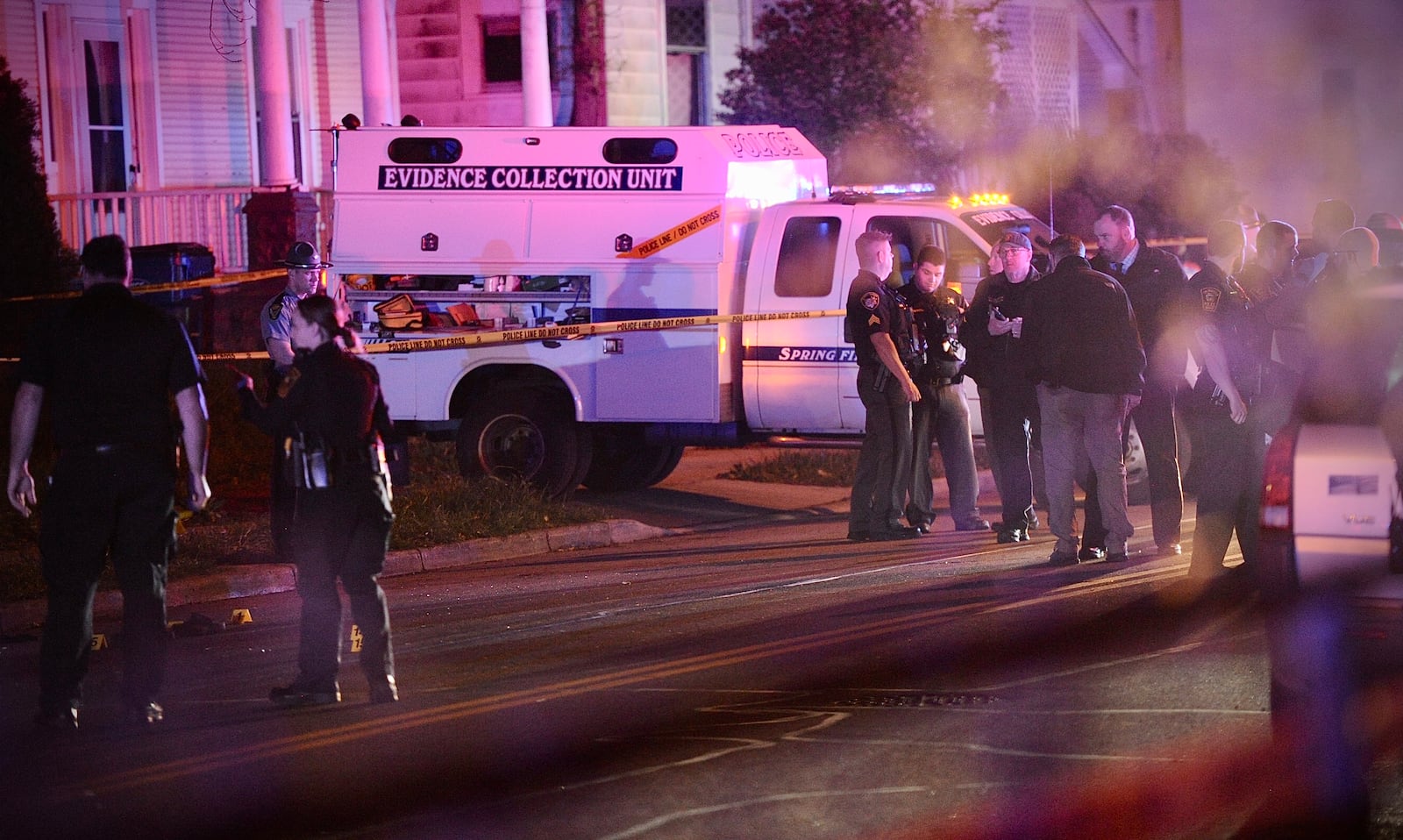 Springfield Police Division officers are shown on the scene of mass shooting Sunday morning May 1, 2022. One person was fatally shot and four others were transported to hospitals with gunshot wounds.  MARSHALL GORBY \STAFF