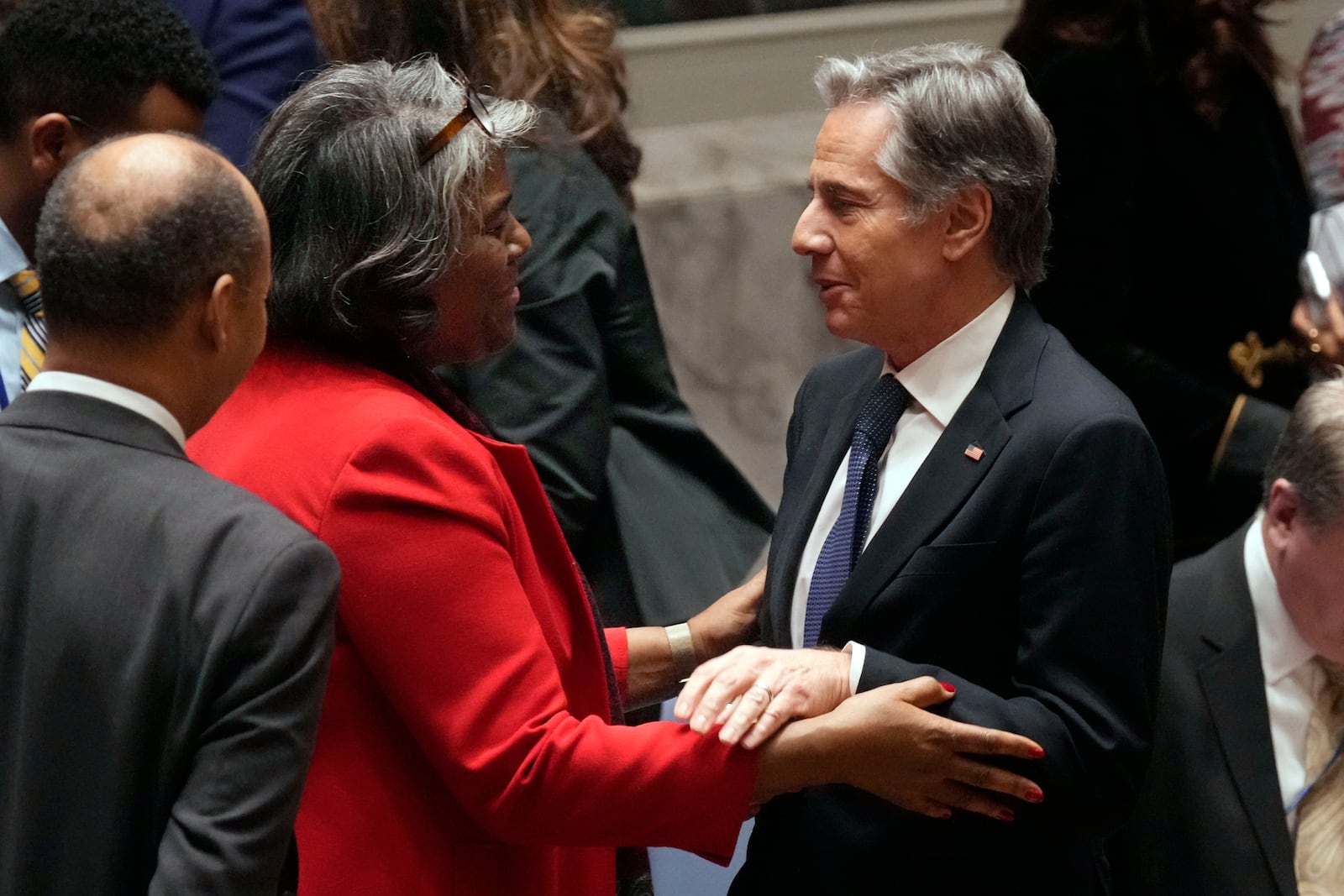 U.S. UN Ambassador Linda Thomas-Greenfield talks with US Secretary of State Antony Blinken after a meeting in the United Nations Security Council, Thursday, Dec. 19, 2024. (AP Photo/Richard Drew)