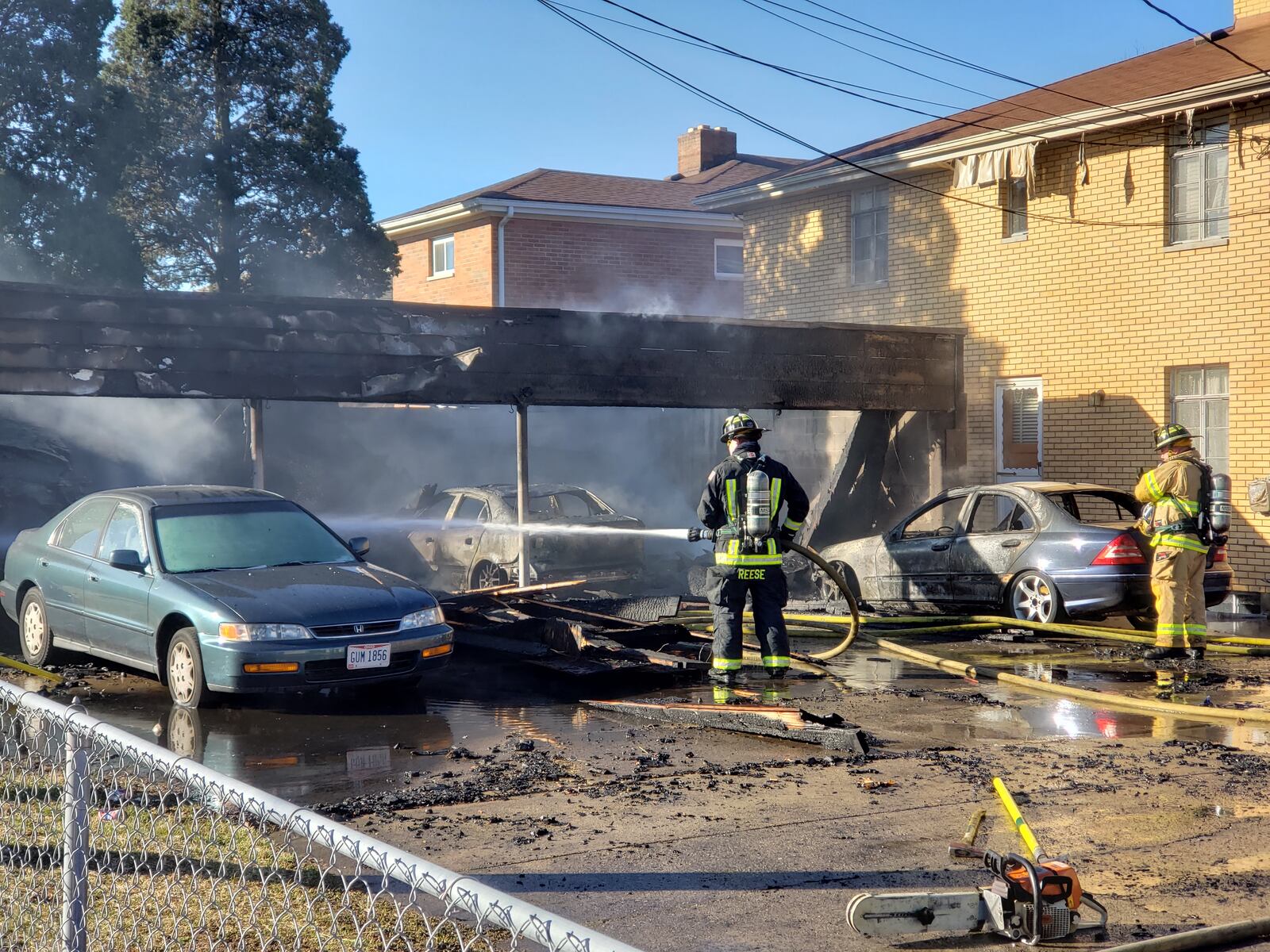 Several cars were heavily burned in a fire at a garage behind apartments on Arlington Avenue in Hamilton on Monday, Feb. 25, 2019. NICK GRAHAM / STAFF