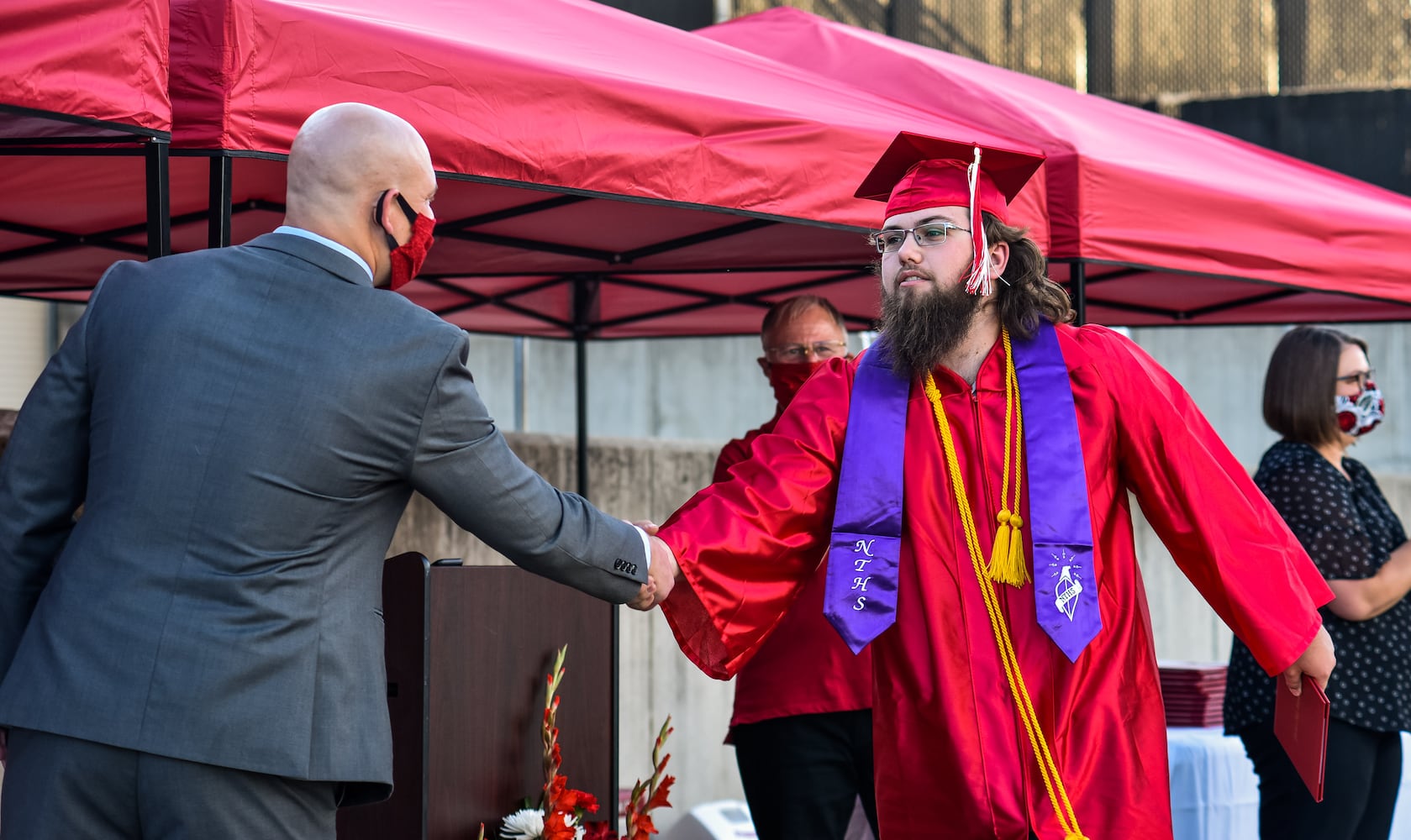 Madison High School drive-thru graduation ceremony at Land of Illusion