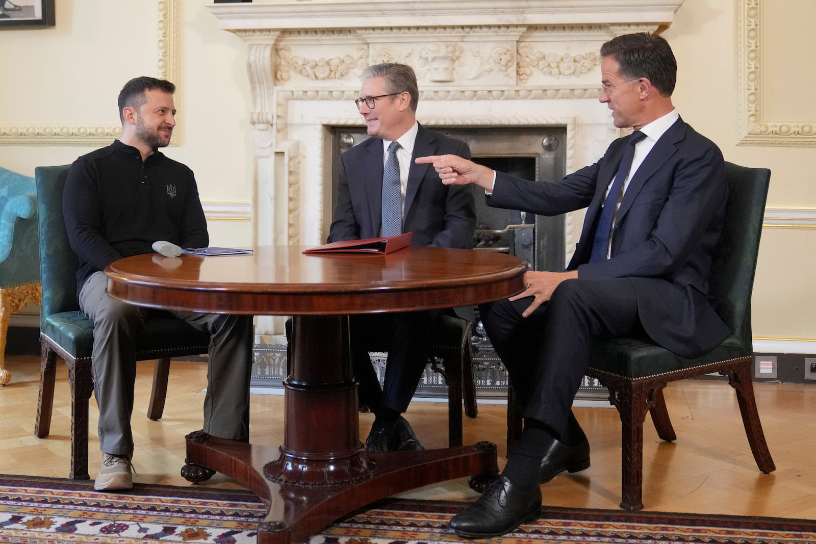 Britain's Prime Minister Keir Starmer, center, NATO Secretary General Mark Rutte, right, and Ukrainian President Volodymyr Zelenskyy meet inside 10 Downing Street in London, Thursday, Oct. 10, 2024.(AP Photo/Kin Cheung, Pool)