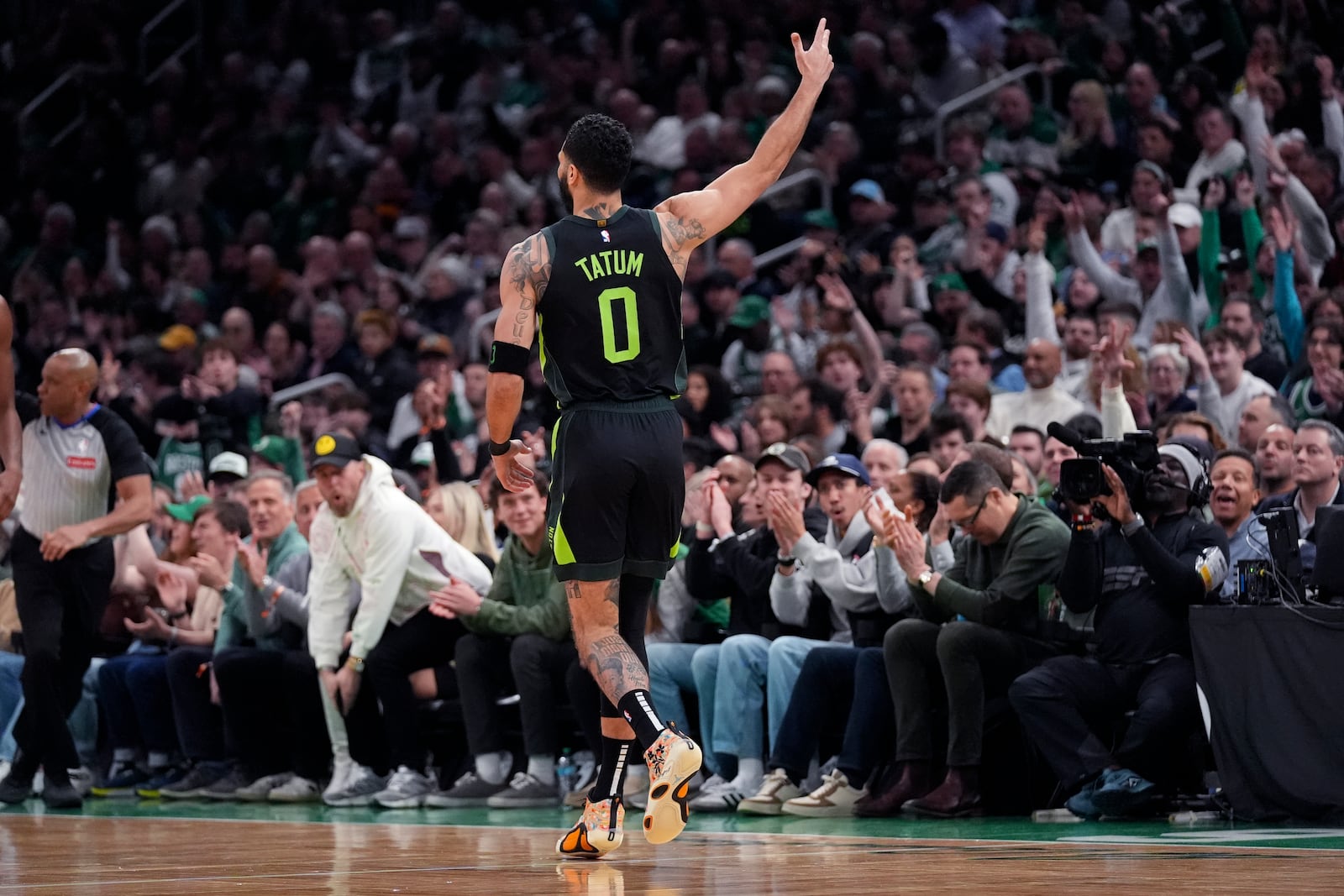 Boston Celtics forward Jayson Tatum (0) celebrates after making a 3-pointer during the first half of an NBA basketball game against the Cleveland Cavaliers, Friday, Feb. 28, 2025, in Boston. (AP Photo/Charles Krupa)