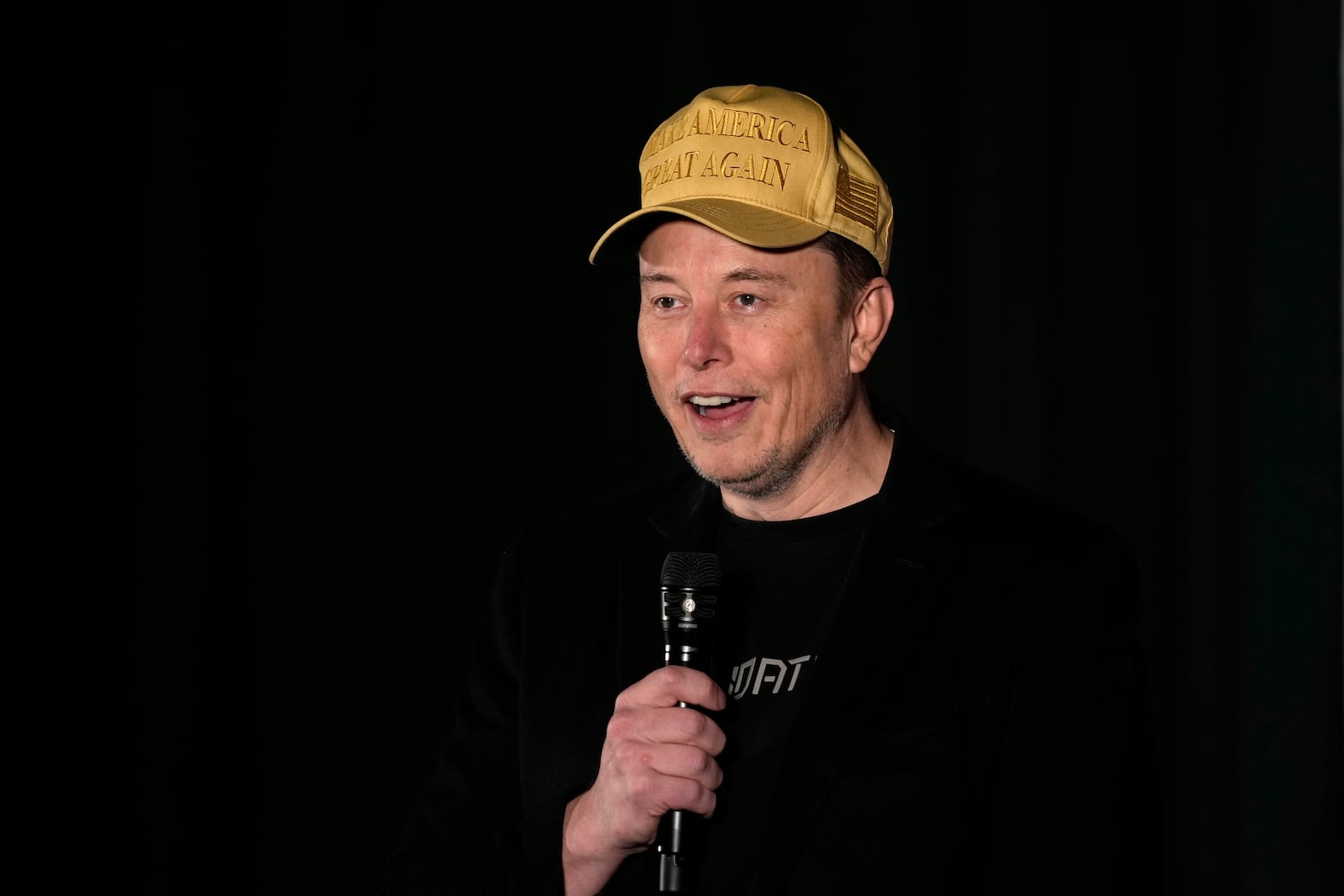 Elon Musk speaks as part of a campaign town hall in support of Republican presidential nominee former President Donald Trump in Folsom, Pa., Thursday, Oct. 17, 2024. (AP Photo/Matt Rourke)