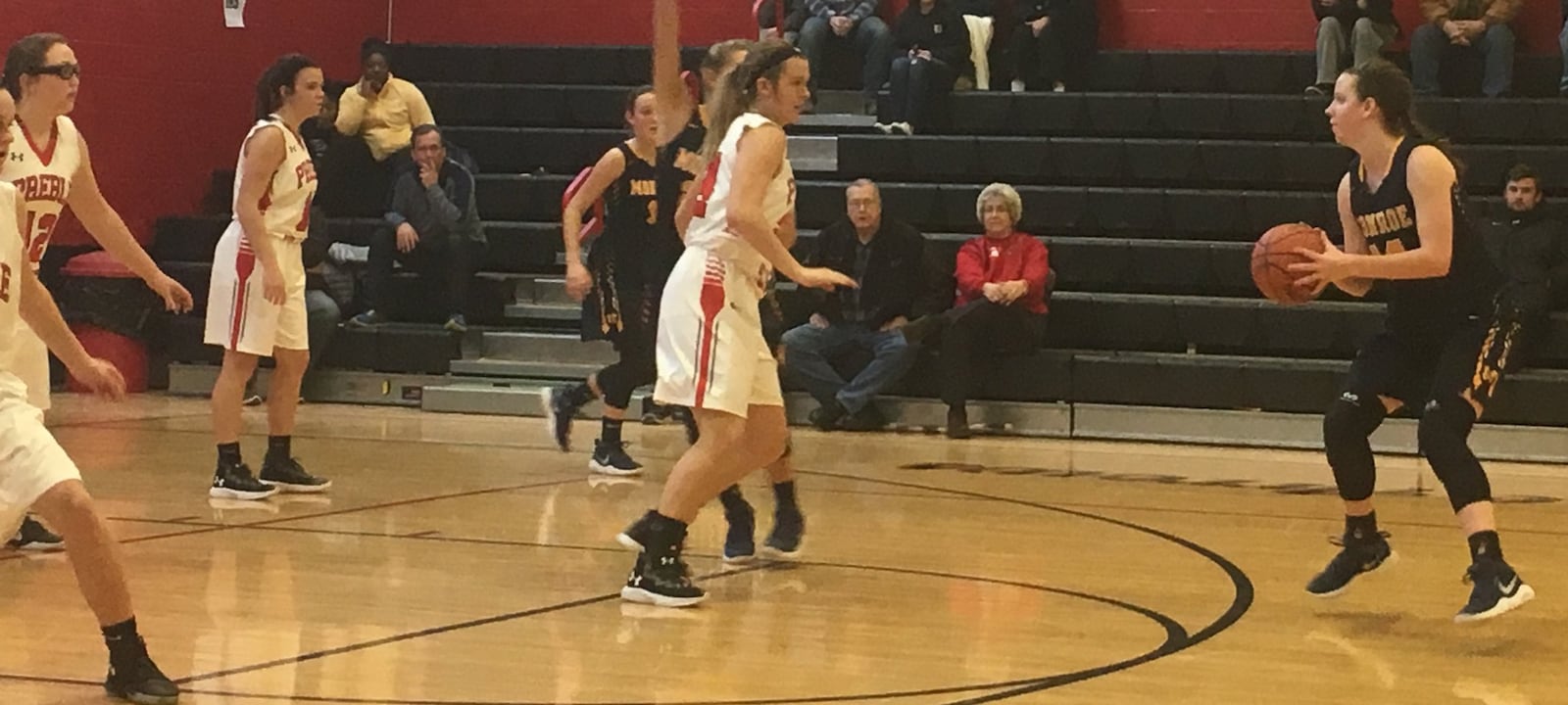 Monroe’s Sophie Sloneker (14) prepares to put up a 3-pointer over Preble Shawnee’s Kaylie Campbell (22) during Saturday afternoon’s game in Camden. RICK CASSANO/STAFF