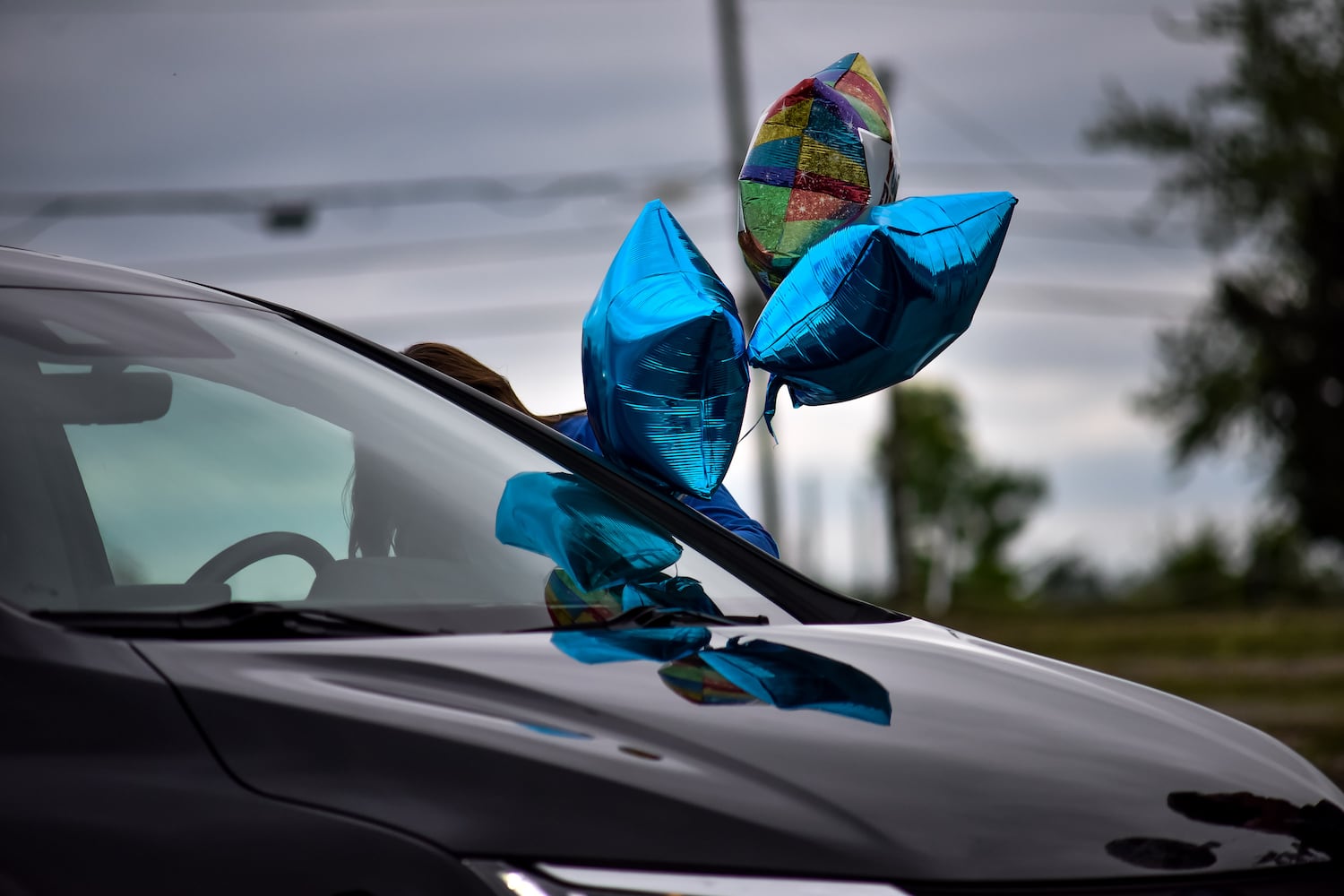 Hamilton High School seniors celebrate graduation at Holiday Auto Theatre drive-in