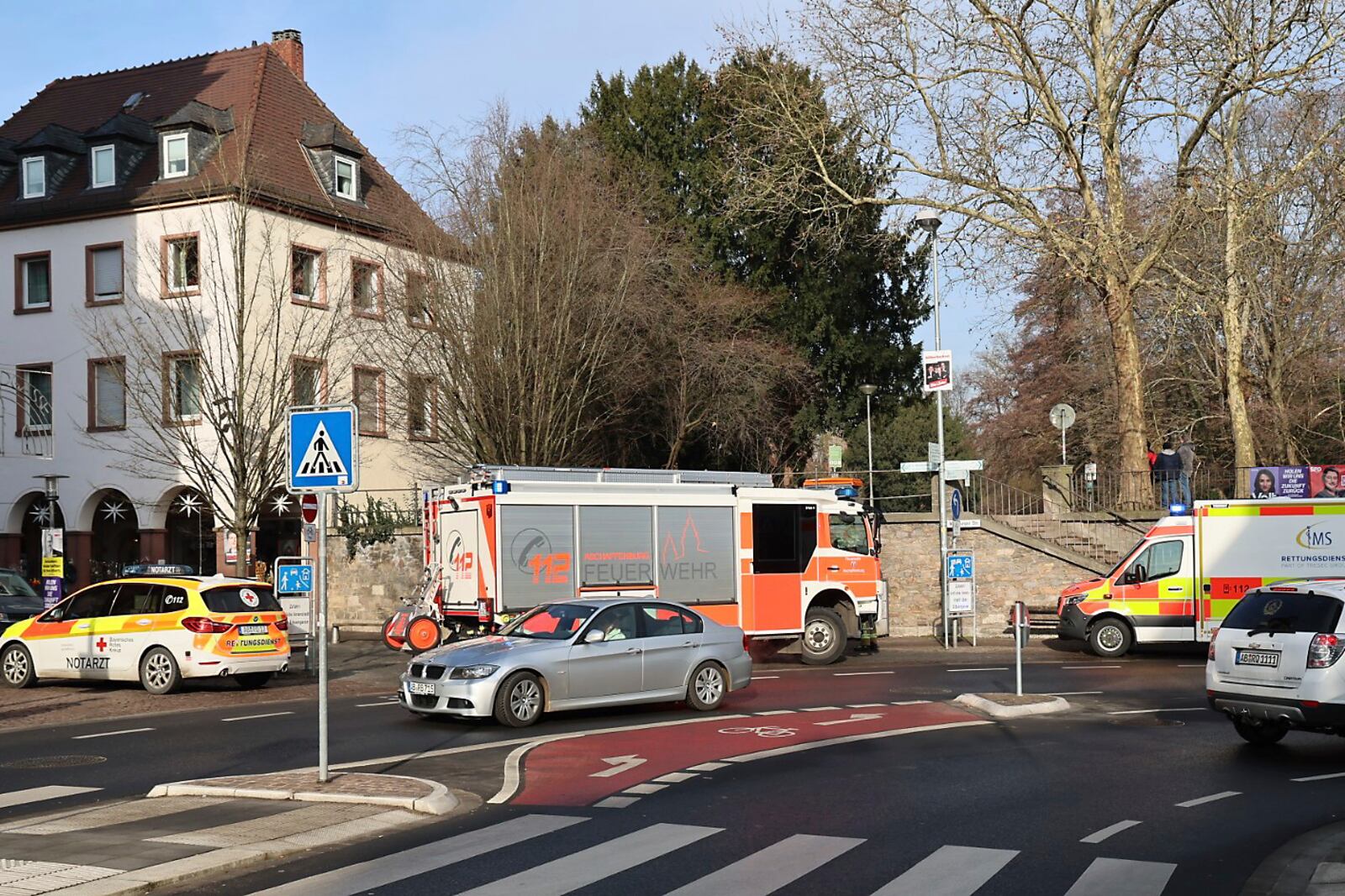 Rescue vehicles are seen near a crime scene in Aschaffenburg, Germany, Wednesday, Jan 22, 2025, where two people were killed in a knife attack. (Ralf Hettler/dpa via AP)