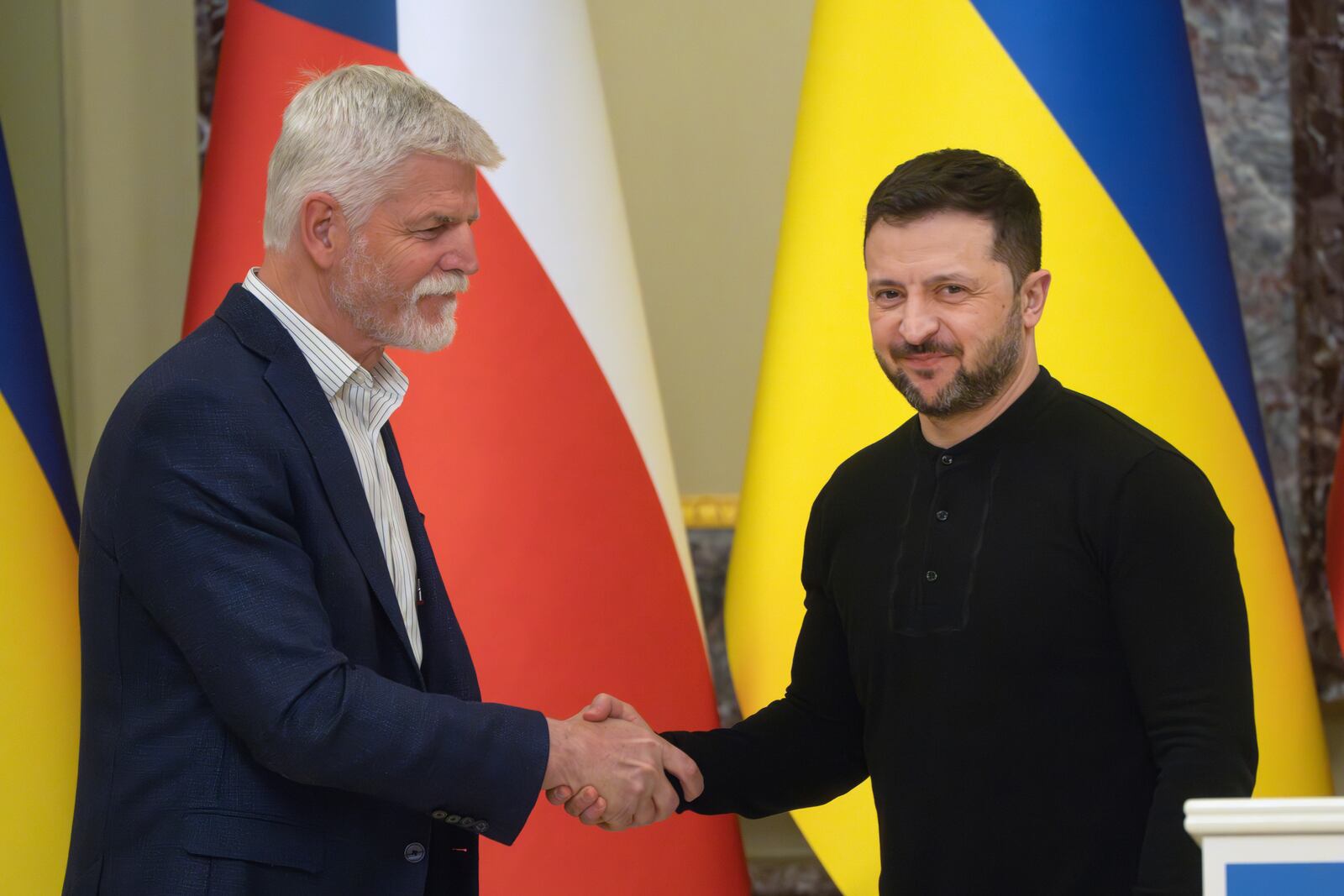 Ukrainian President Volodymyr Zelenskyy, right, and Czech Rebublic's President Petr Pavel shake hands during their meeting in Kyiv, Ukraine, Friday, March 21, 2025. (AP Photo/Efrem Lukatsky)