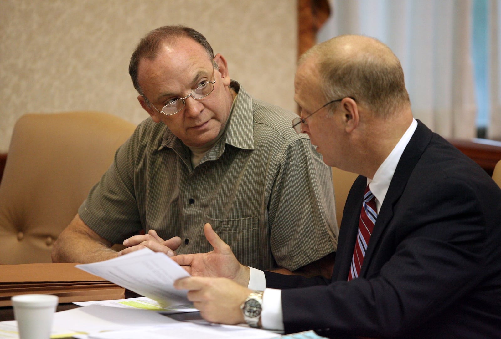 Raymond Tanner talks with his attorney Greg Howard, who is now a Butler County Common Pleas judge, during a hearing Sept. 25, 2009, where he was ordered to remain under court control by Butler County Common Pleas Judge Andrew Nastoff. Tanner was found not guilty by reason of insanity after decapitating his wife on Valentine's Day in 1990. FILE