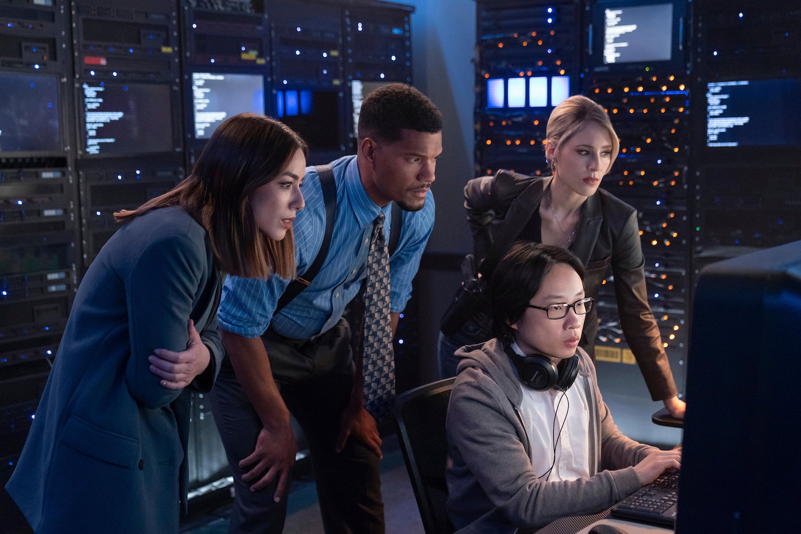 This image released by Hulu shows, from left, Chloe Bennet, Sullivan Jones, Jimmy O. Yang and Lisa Gilroy in a scene from the series "Interior Chinatown." (Mike Taing/Hulu via AP)