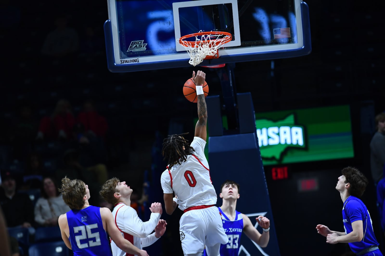 Lakota West's Bryce Curry (0) slams one home against St. Xavier in a Division I regional semifinal on Wednesday night at Xavier University's Cintas Center. Kyle Hendrix/CONTRIBUTED