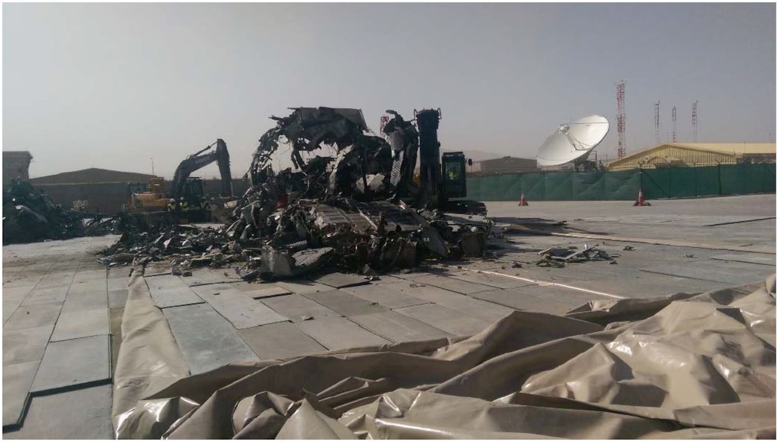 Photo attributed to the Defense Logistics Agency in August 2014 of G222 aircraft destroyed for scrap on the tarmac of Kabul International Airport included in a report from the Special Inspector General for Afghanistan Reconstruction on the G222 program