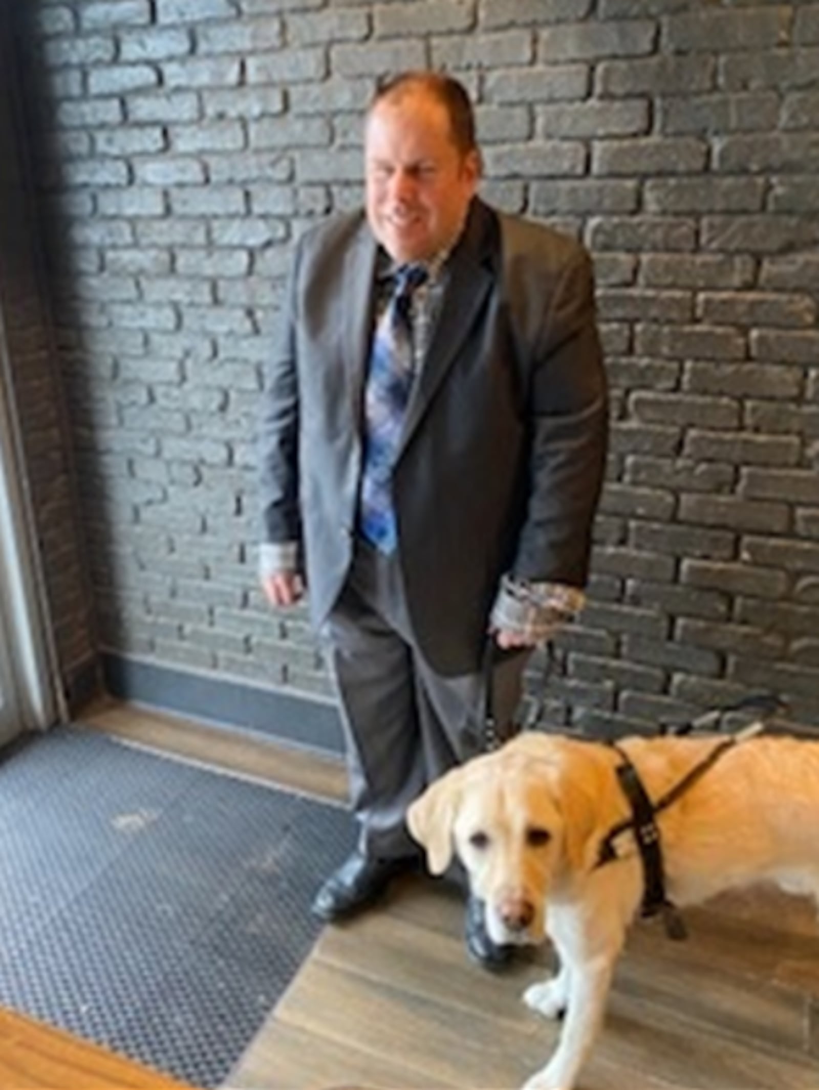 Attorney Timothy Meloy is seen with his guide dog, Dusty. CONTRIBUTED