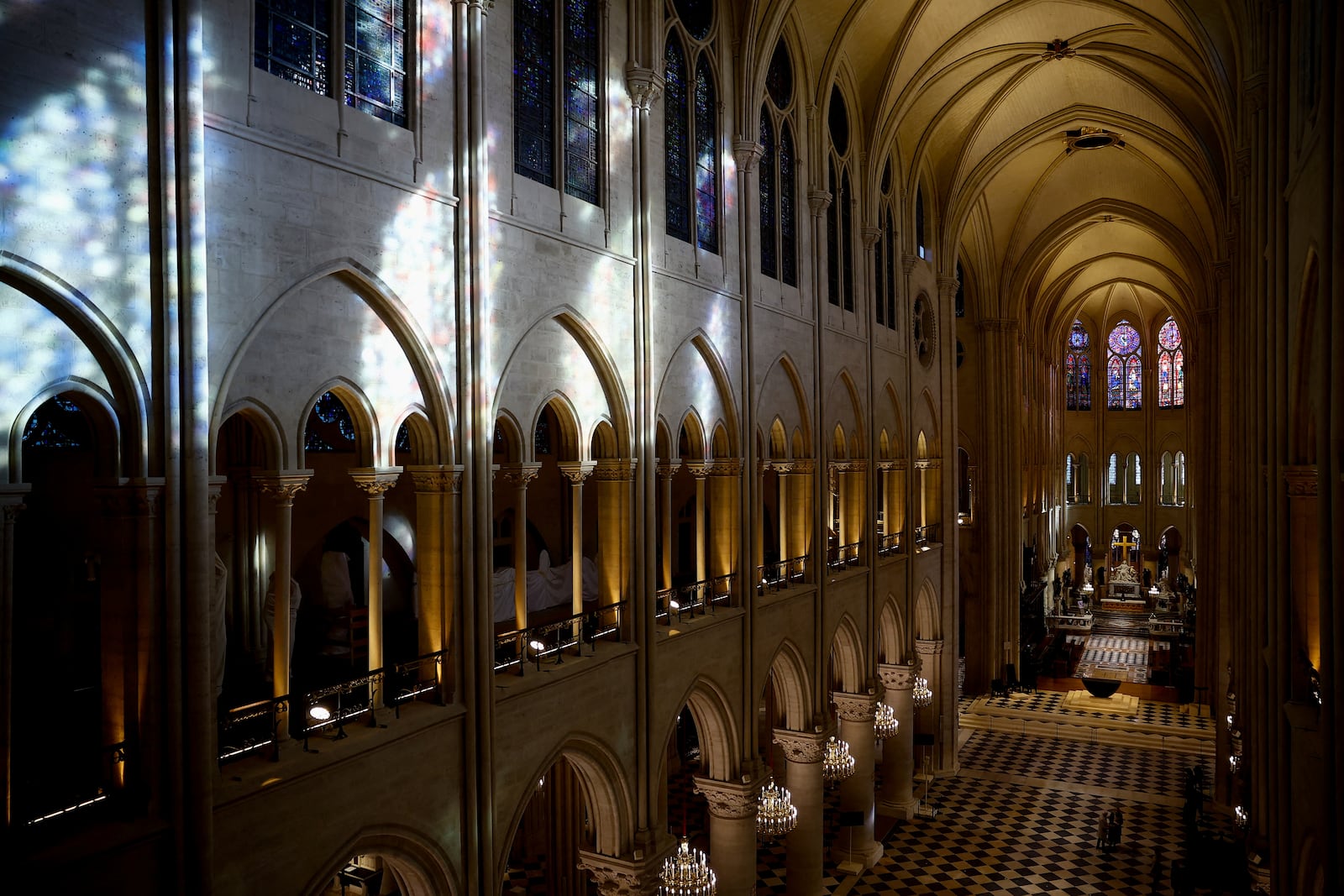 The nave of Notre-Dame de Paris cathedral is seen while French President Emmanuel Macron visits the restored interiors of the monument, Friday, Nov. 29, 2024 in Paris. (Sarah Meyssonnier/Pool via AP)