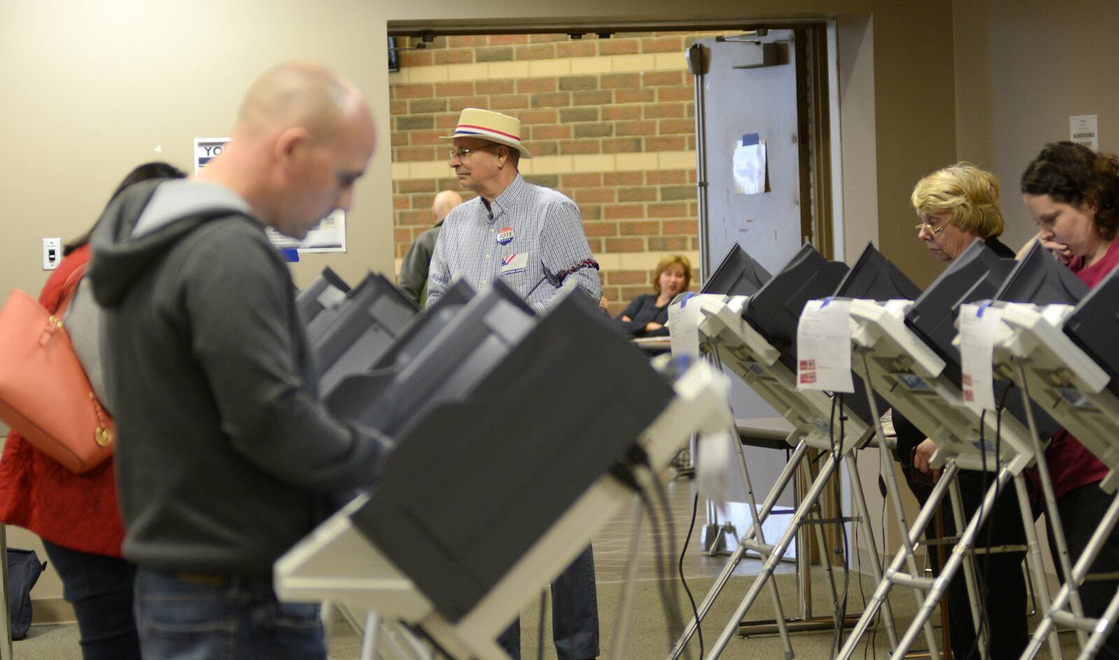 Online voter registration will be live at midnight on Jan. 1, 2017, and while there isn’t going to be an influx of new registrations in the first year, Ohio Secretary of State Jon Husted believes we could see a significant increase in that number by the 2020 election. Pictured is a poll worker looking over the voting area inside Fairfield High School on Holden Boulevard this past Election Day, Nov. 8, 2016.