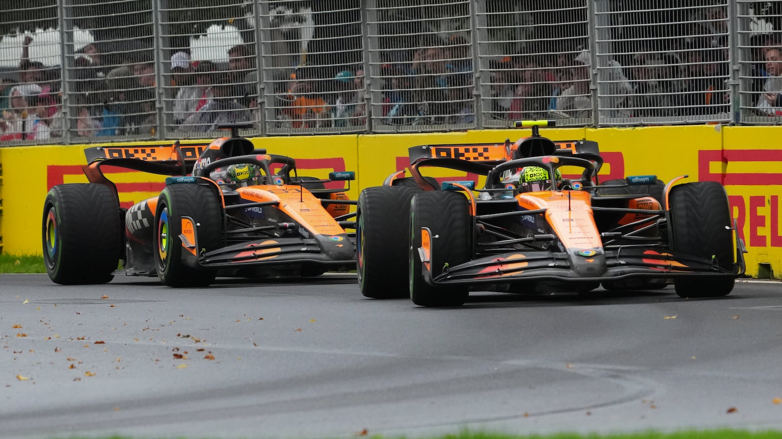 McLaren driver Lando Norris of Britain leads teammate Oscar Piastri of Australia during the Australian Formula One Grand Prix at Albert Park, in Melbourne, Australia, Sunday, March 16, 2025. (AP Photo/Scott Barbour)