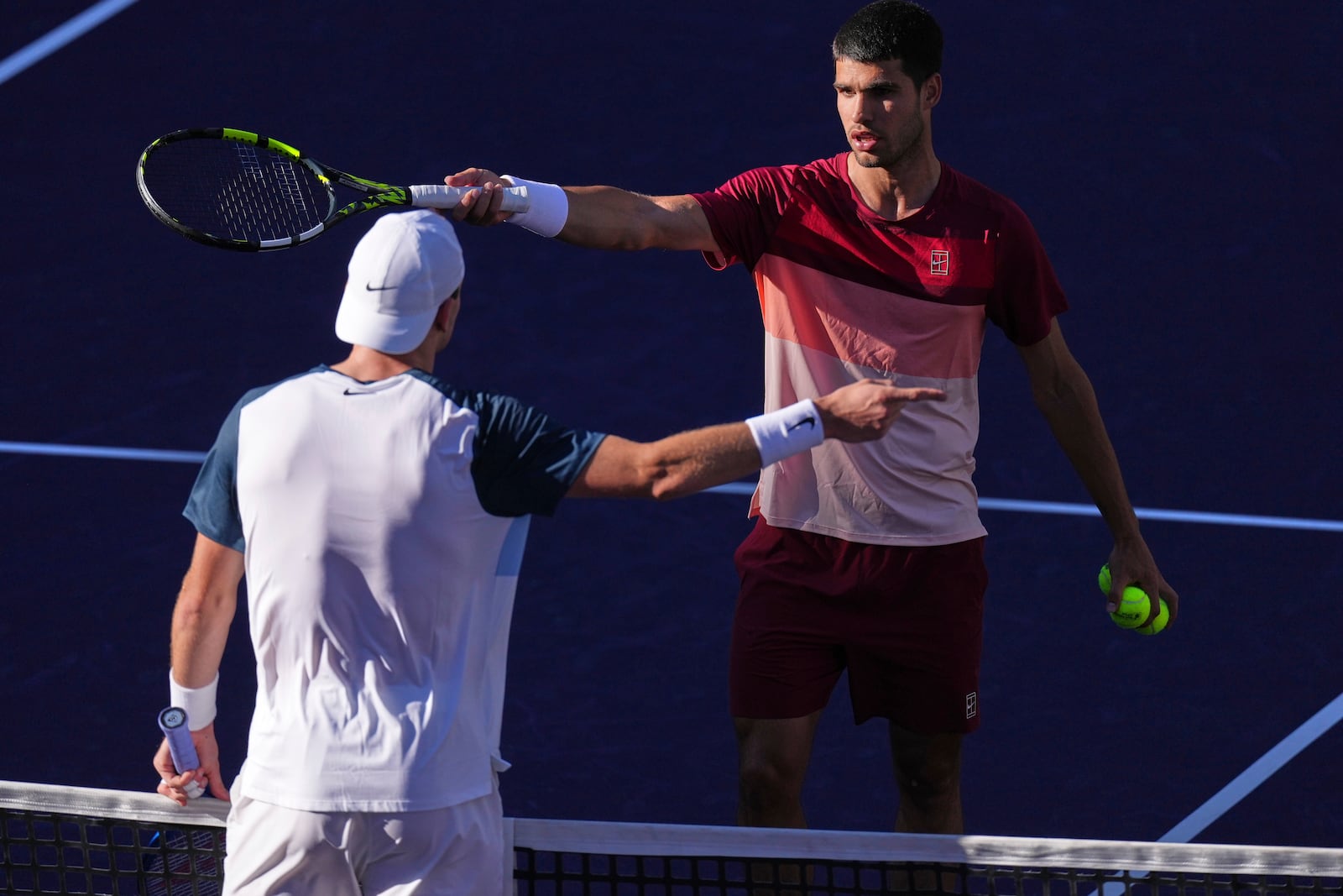 Carlos Alcaraz, of Spain, right, discusses a call with Jack Draper, of Great Britain, during their semifinals match at the BNP Paribas Open tennis tournament Saturday, March 15, 2025, in Indian Wells, Calif. (AP Photo/Mark J. Terrill)