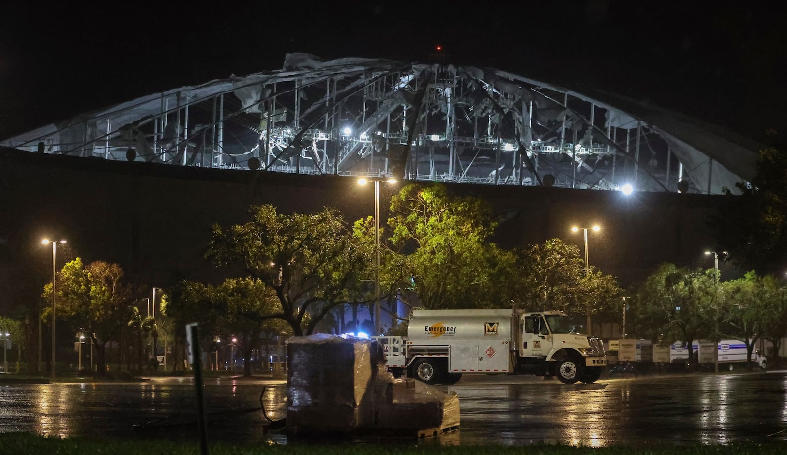 The roof of Tropicana Field, the home of the Tampa Bay Rays, appeared to be badly damaged as Hurricane Milton passes Thursday, Oct. 10, 2024, in St. Petersburg, Fla. (Chris Urso/Tampa Bay Times via AP)