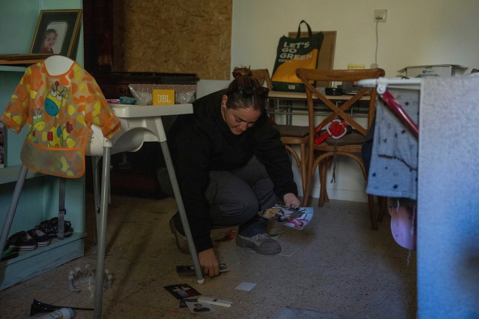 Inbal Limor, an Israeli displaced by the Israel-Hezbollah conflict, returns to her home in Kibbutz Manara to clean and organize after the ceasefire, in northern Israel, Monday Dec. 2, 2024. (AP Photo/Ohad Zwigenberg)