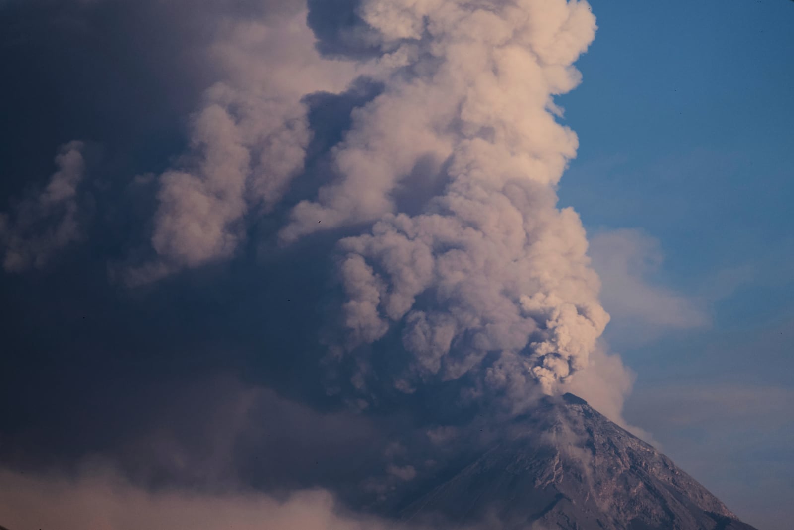 The "Volcan de Fuego," or Volcano of Fire, blows a thick cloud of ash, seen from Palin, Guatemala, Monday, March 10, 2025. (AP Photo/Moises Castillo)