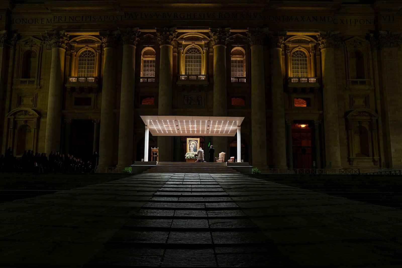 Cardinal Giovanni Batista Re leads a nightly rosary prayer service for the health of Pope Francis in St. Peter's Square at the Vatican, Wednesday, Feb. 26, 2025. (AP Photo/Bernat Armangue)