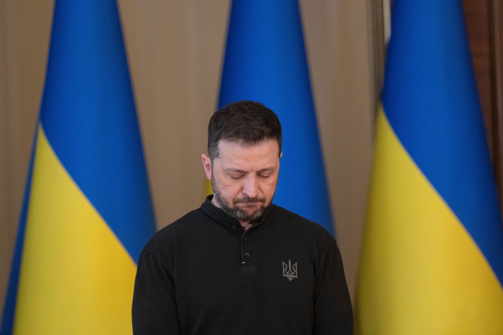 Ukrainian President Volodymyr Zelenskyy reacts during a briefing in Kyiv, Ukraine, Wednesday, March 12, 2025. (AP Photo/Efrem Lukatsky)