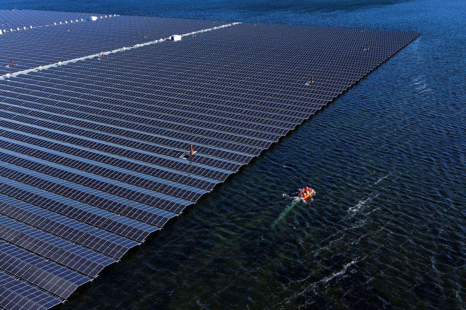 FILE - A floating solar farm operates on the Cottbuser Ostsee lake near Cottbus, Germany, Oct. 16, 2024. (AP Photo/Matthias Schrader, File)