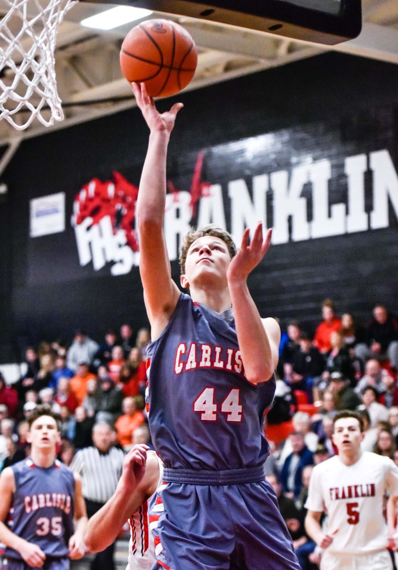 Carlisle's Nolan Burney drives to the hoop during Tuesday night’s game against Carlisle at Darrell Hedric Gym in Franklin. NICK GRAHAM/STAFF