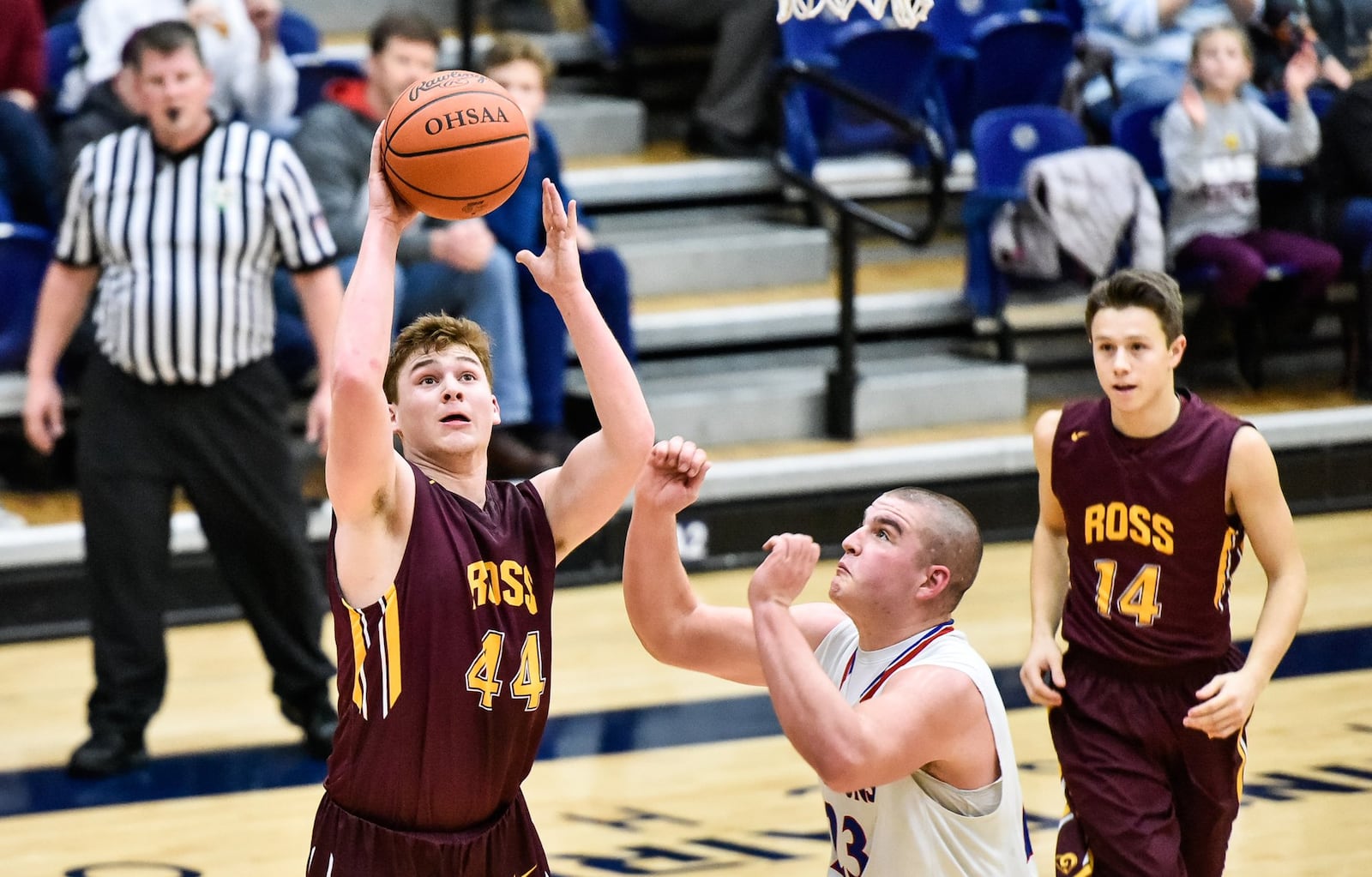 Joe Valentine of Ross goes up for a shot over Clinton-Massie’s Trey Uetrecht during their Division II sectional boys basketball game against Clinton-Massie on Feb. 23 at Fairmont’s Trent Arena in Kettering. NICK GRAHAM/STAFF