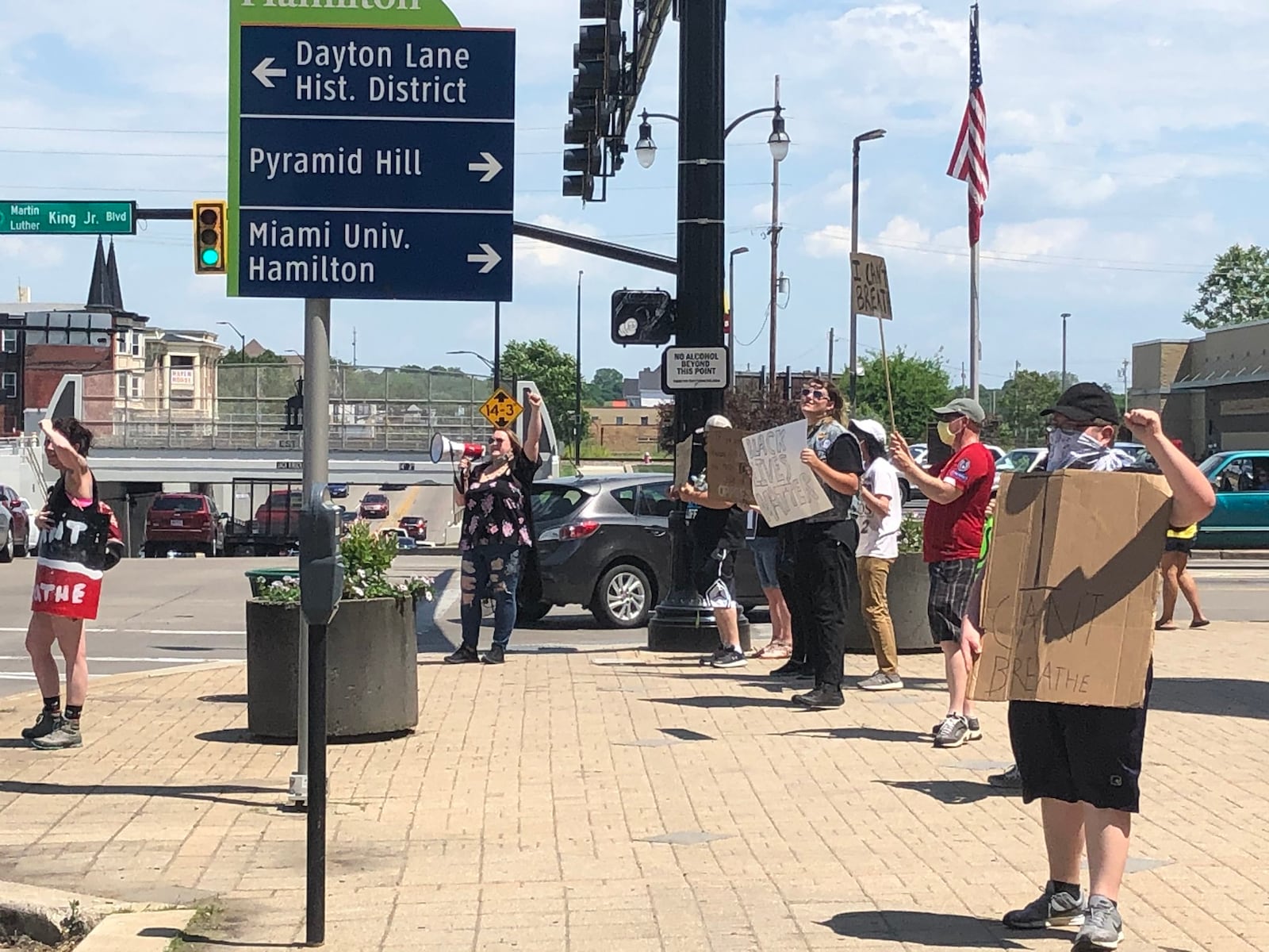 A small crowd gathered in protest in Hamilton at the corner of Martin Luther King Jr. Boulevard and High Street on Saturday, June 6, 2020. RICK McCRABB / STAFF