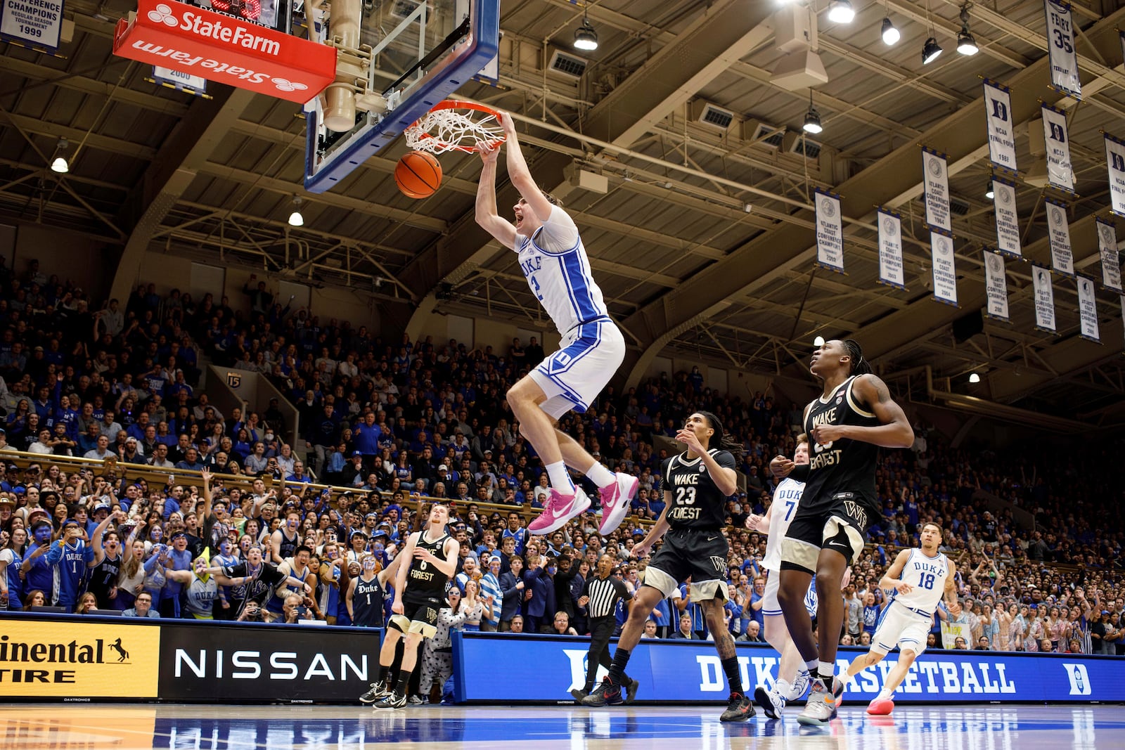 Duke's Cooper Flagg (2) dunks during the second half of an NCAA college basketball game against Wake Forest in Durham, N.C., Monday, March 3, 2025. (AP Photo/Ben McKeown)