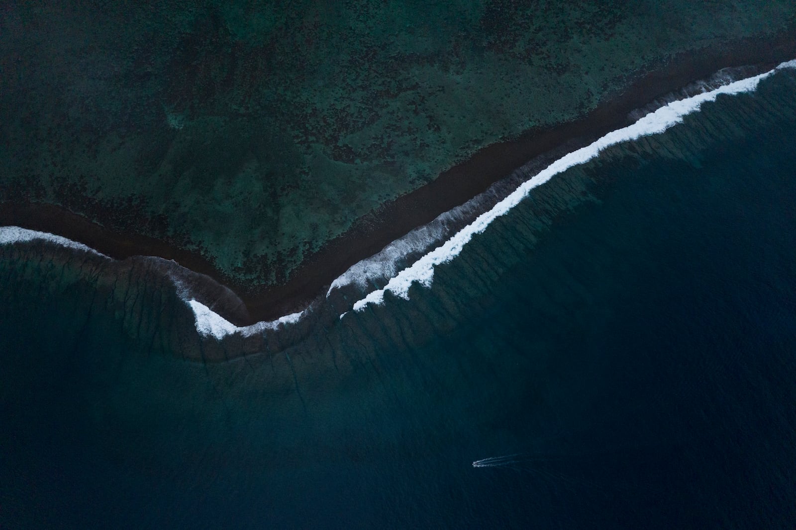 FILE - A wave at Teahupo'o crashes onto the coral reef in Tahiti, French Polynesia, Jan. 11, 2024. (AP Photo/Daniel Cole, File)