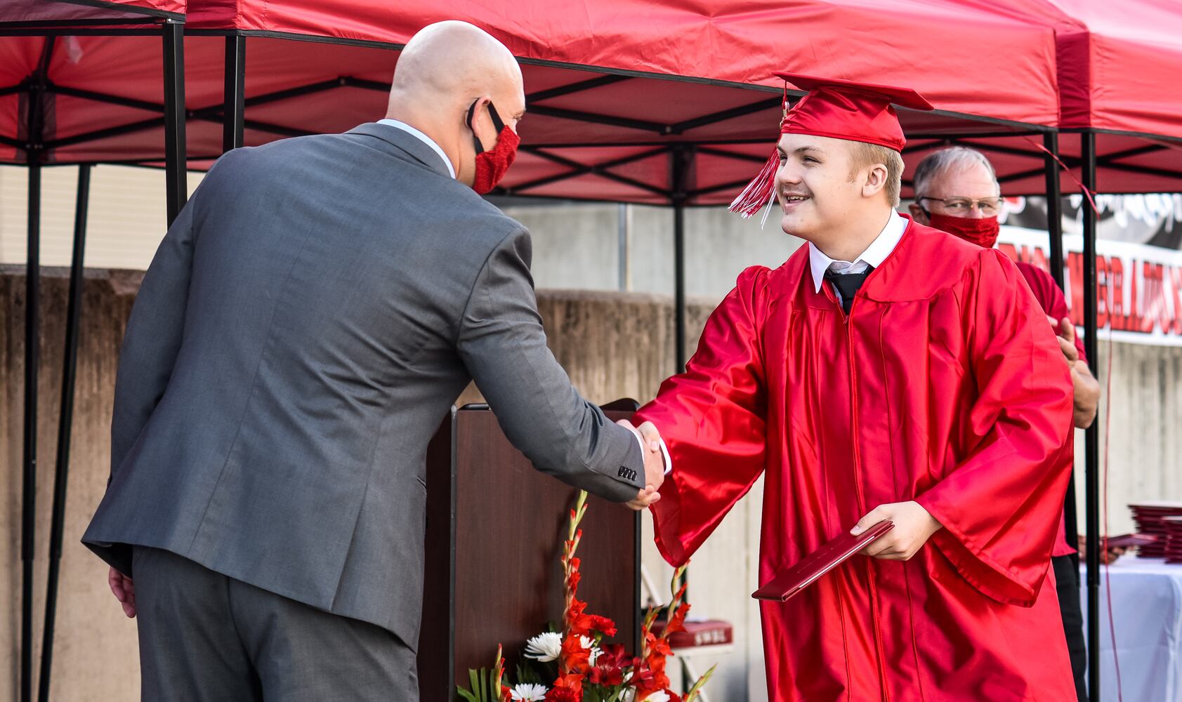 Madison High School drive-thru graduation ceremony at Land of Illusion