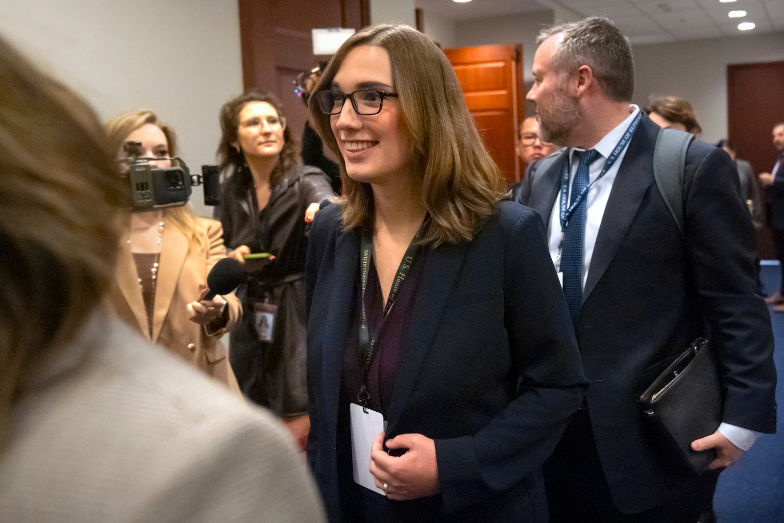 Rep.-elect Sarah McBride, D-Del., center, leaves a meeting of House Democrats on Capitol Hill, Tuesday, Nov. 19, 2024, in Washington. (AP Photo/Mark Schiefelbein)