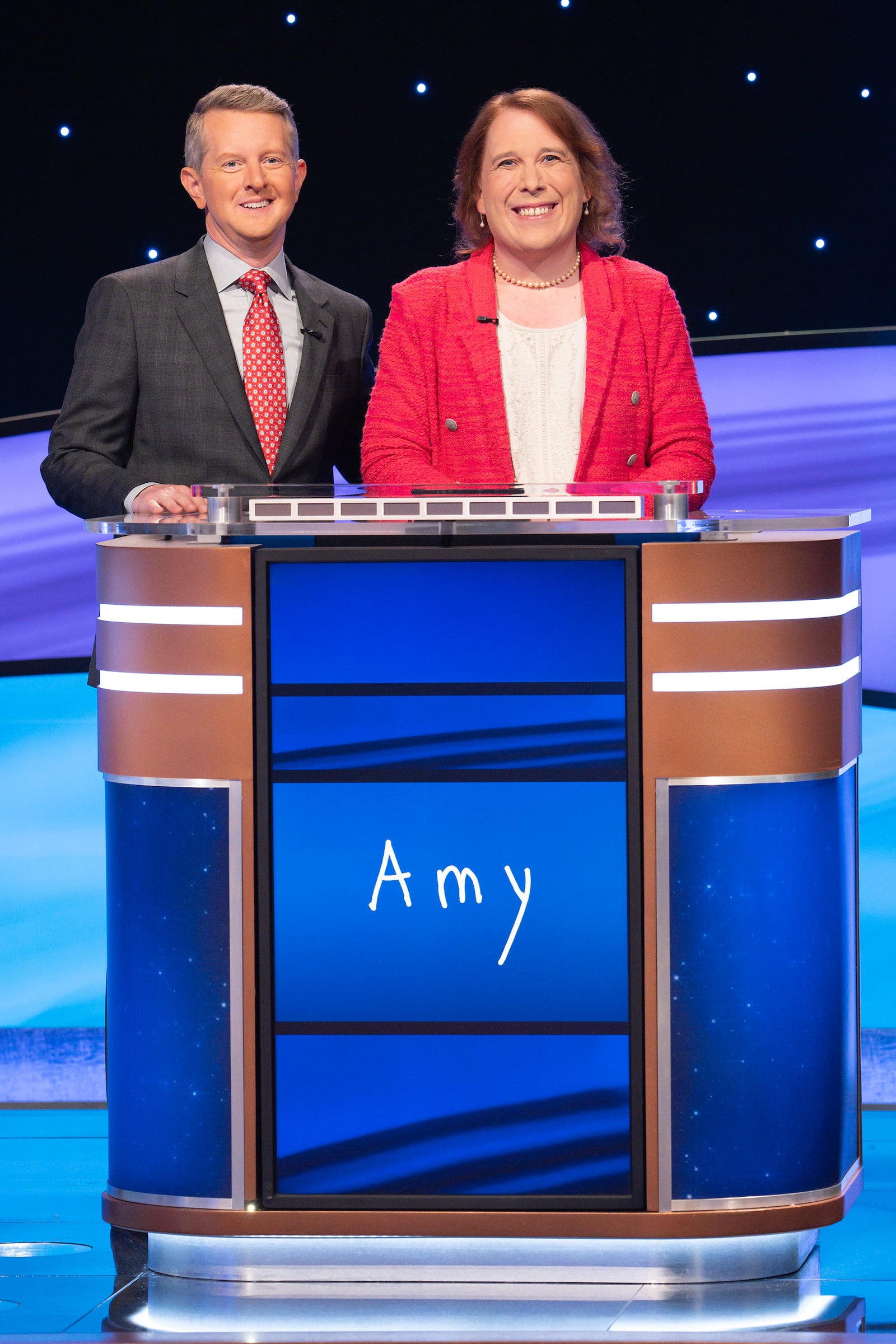 "Jeopardy!" host Ken Jennings with Amy Schneider. (DISNEY/Eric McCandless)