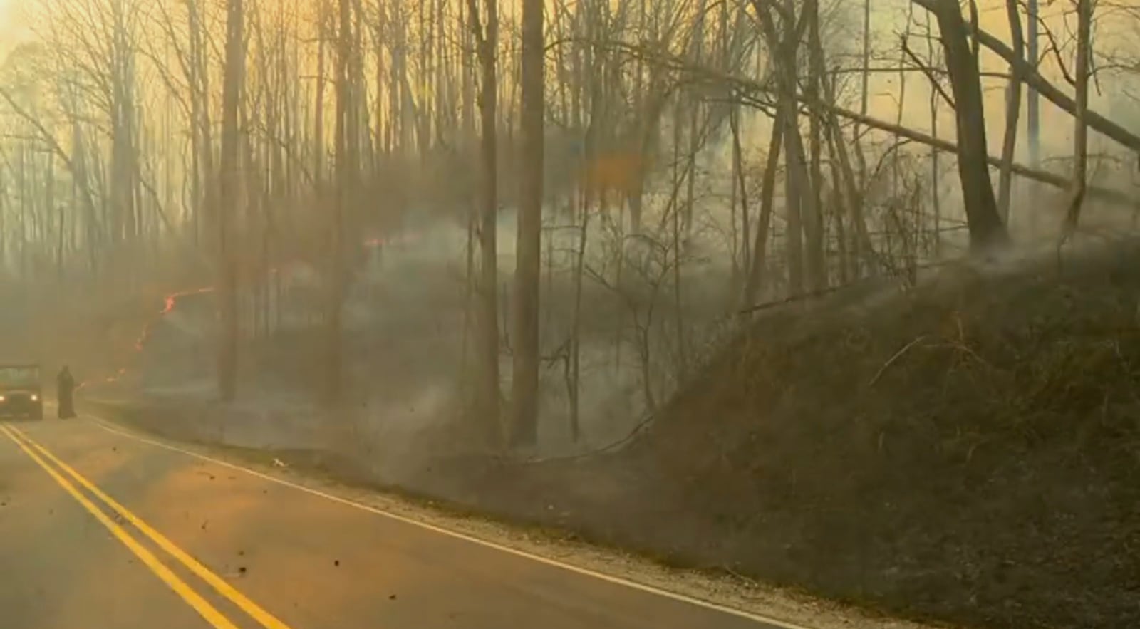 Firefighters prepare to fight the wildfires in Polk County, N.C., on Saturday, March 22, 2025. (WLOS-TV via AP)