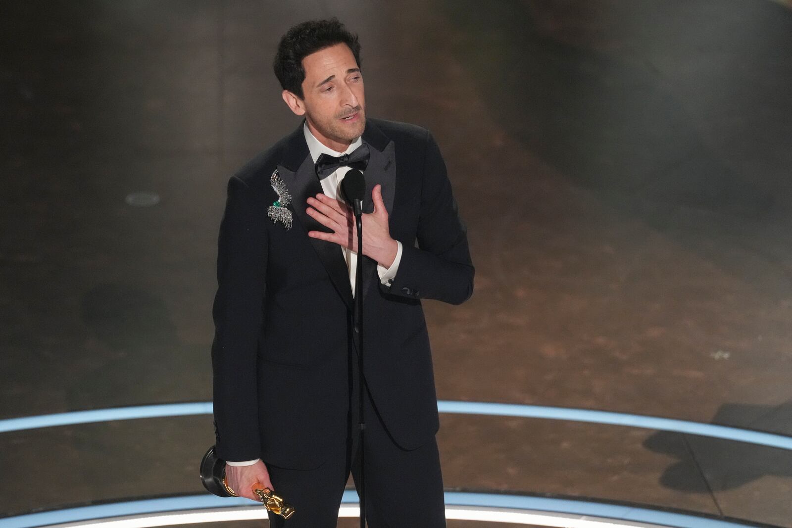 Adrien Brody accepts the award for best performance by an actor in a leading role for "The Brutalist" during the Oscars on Sunday, March 2, 2025, at the Dolby Theatre in Los Angeles. (AP Photo/Chris Pizzello)