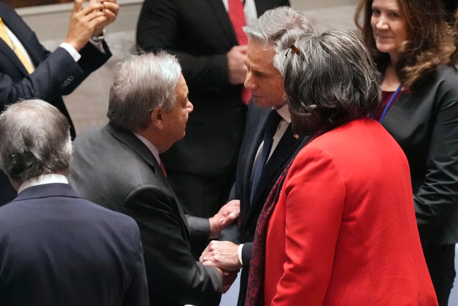 U.S. Secretary of State Antony Blinken, center, talks with UN Secretary General Antonio Guterres, left, and US Ambassador Linda Thomas-Greenfield, right, in the United Nations Security Council, Thursday, Dec. 19, 2024. (AP Photo/Richard Drew)